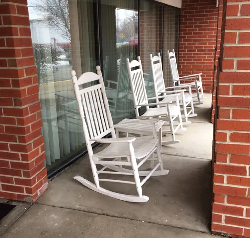 a view of a patio with a table and chairs
