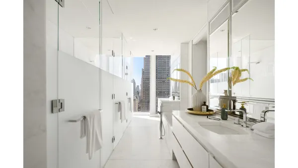 a large white kitchen with a large window