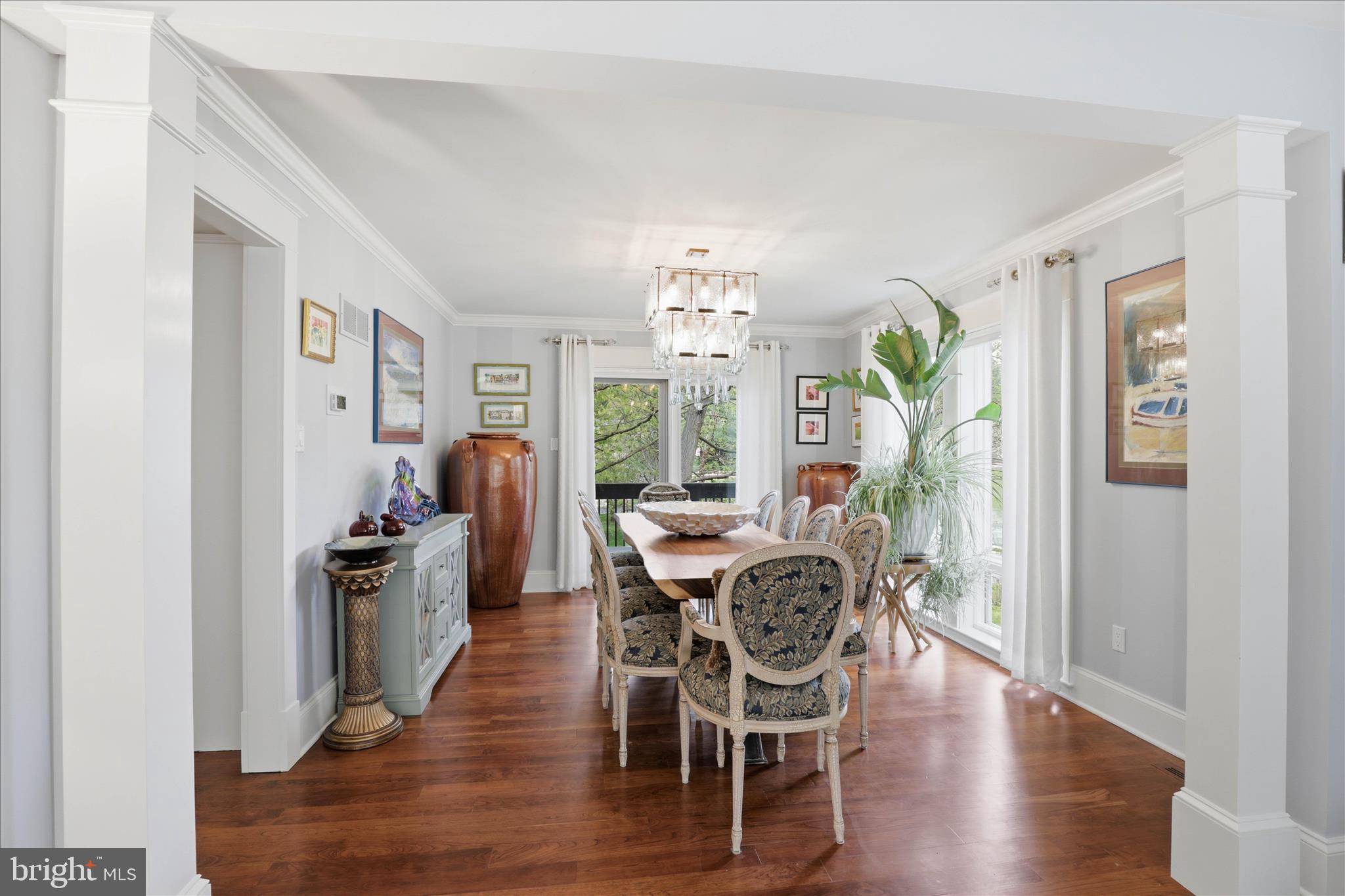 137 East Woods Drive Lititz, PA 17543 - Photo 14 of 64 a view of a dining room with furniture a chandelier and wooden floor