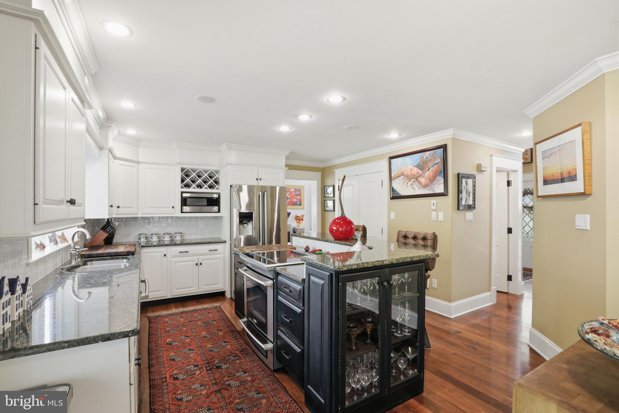 137 East Woods Drive Lititz, PA 17543 - Photo 17 of 64 a open kitchen with stainless steel appliances granite countertop a stove top oven a sink dishwasher and cabinets with wooden floor