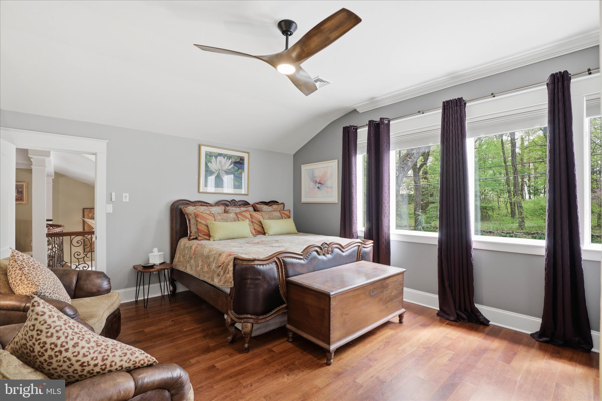 137 East Woods Drive Lititz, PA 17543 - Photo 26 of 64 a spacious bedroom with a bed a couch and a large window