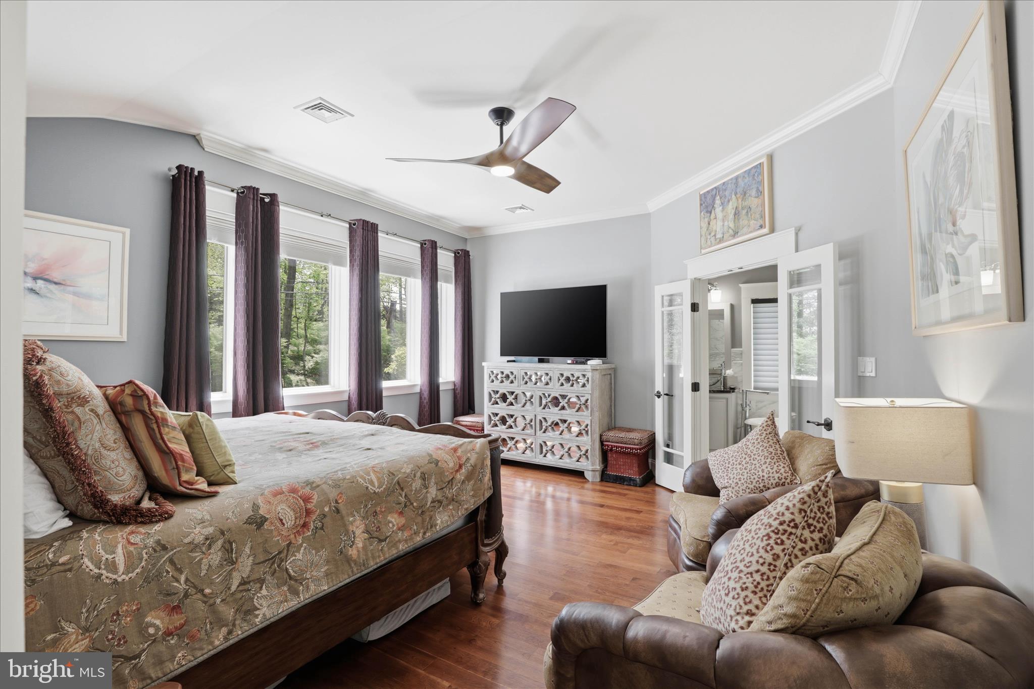 137 East Woods Drive Lititz, PA 17543 - Photo 27 of 64 a bedroom with a bed couches and a flat screen tv