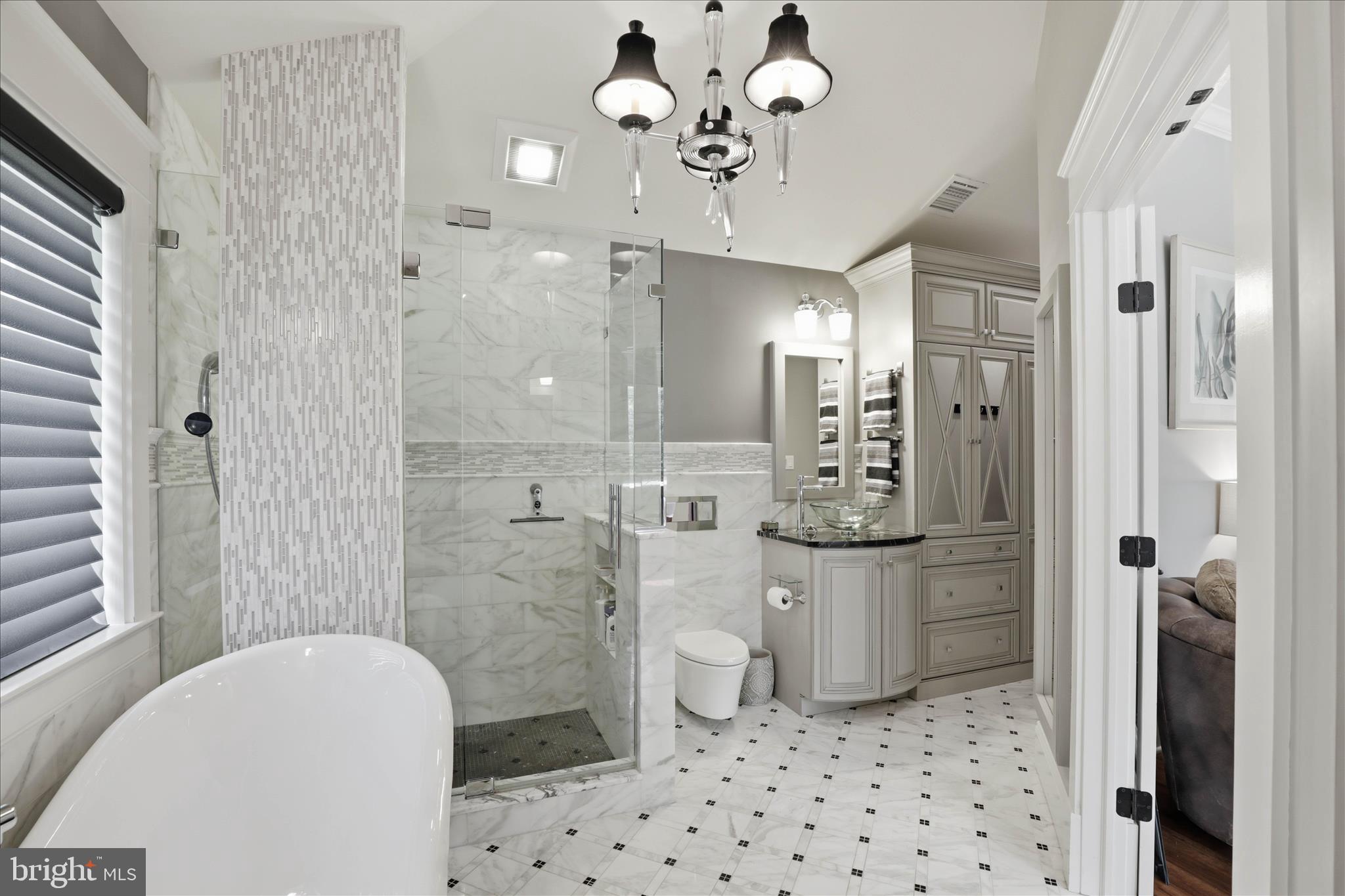 137 East Woods Drive Lititz, PA 17543 - Photo 30 of 64 a bathroom with a sink a toilet a mirror and shower