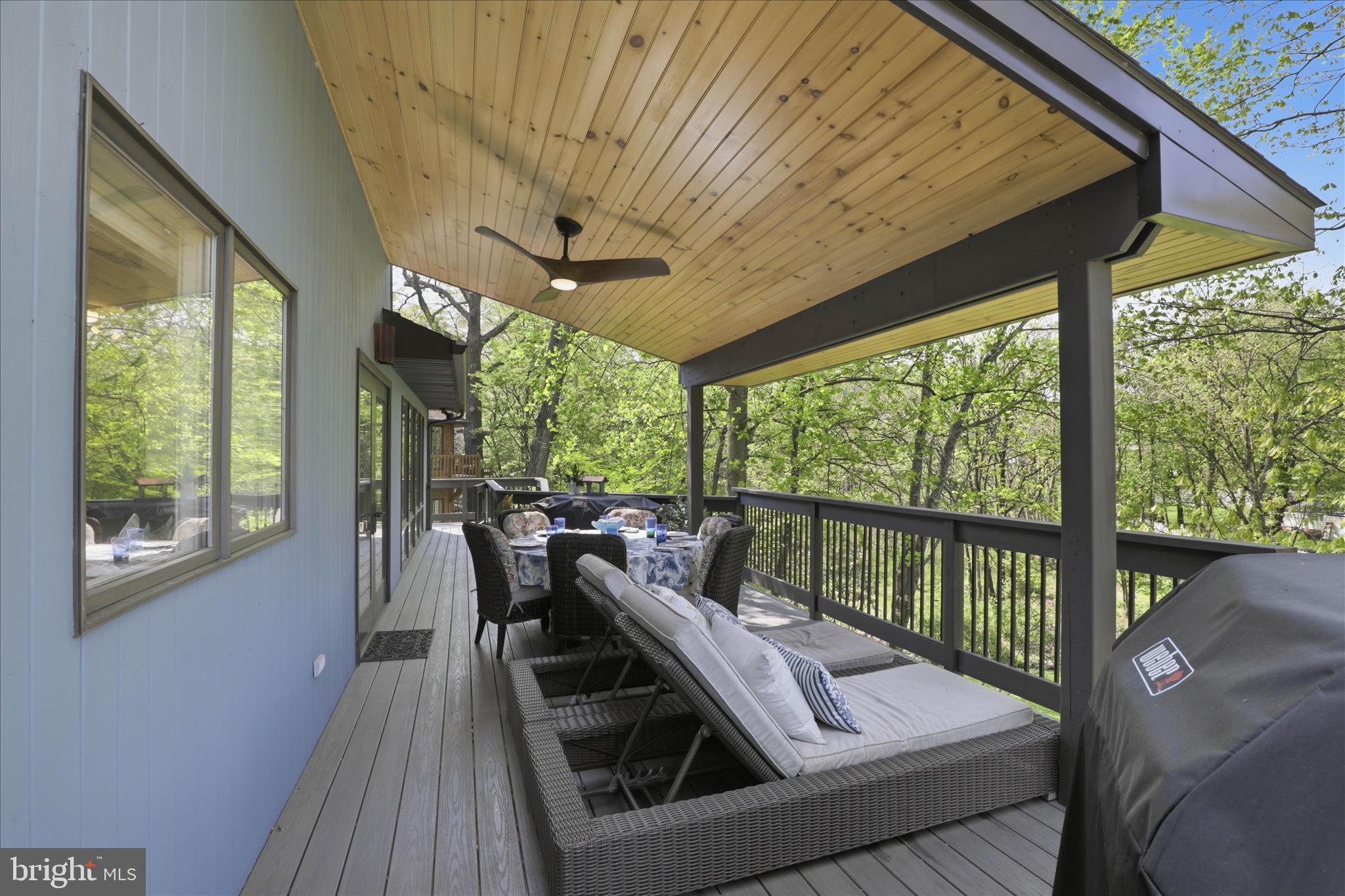 137 East Woods Drive Lititz, PA 17543 - Photo 49 of 64 a view of a living room and balcony with furniture and wooden floor