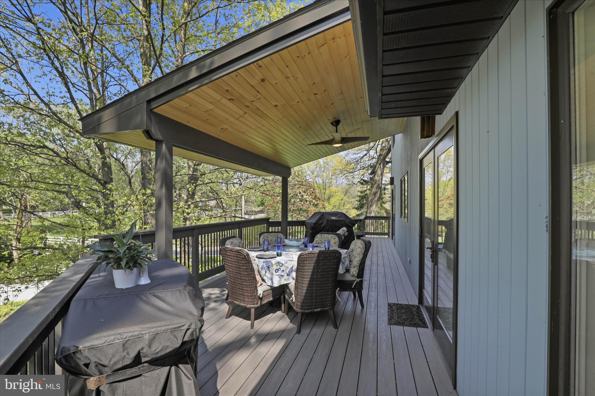 137 East Woods Drive Lititz, PA 17543 - Photo 50 of 64 a view of a patio with table and chairs and wooden floor