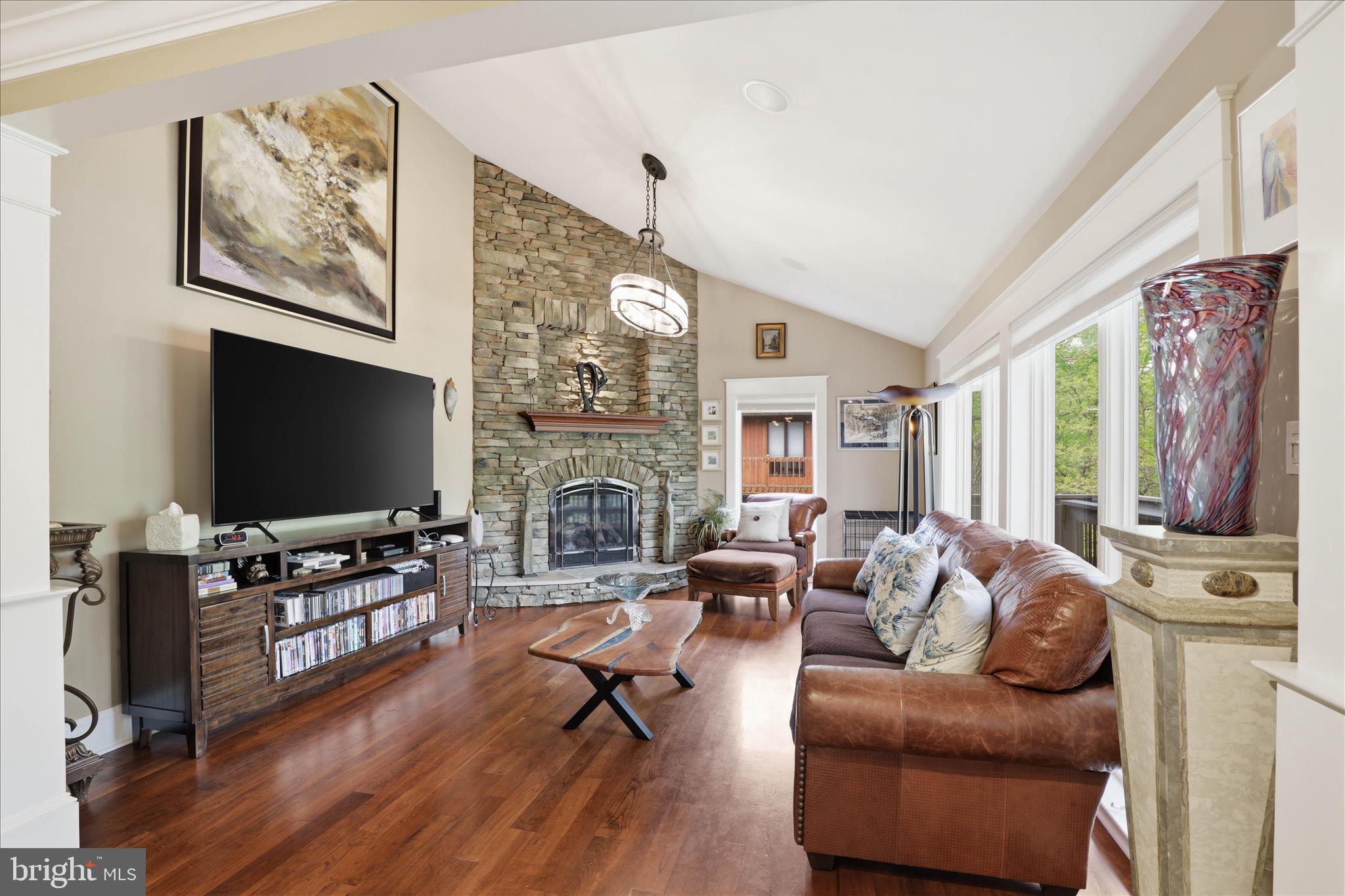 137 East Woods Drive Lititz, PA 17543 - Photo 5 of 64 a living room with fireplace furniture flat screen tv and wooden floor