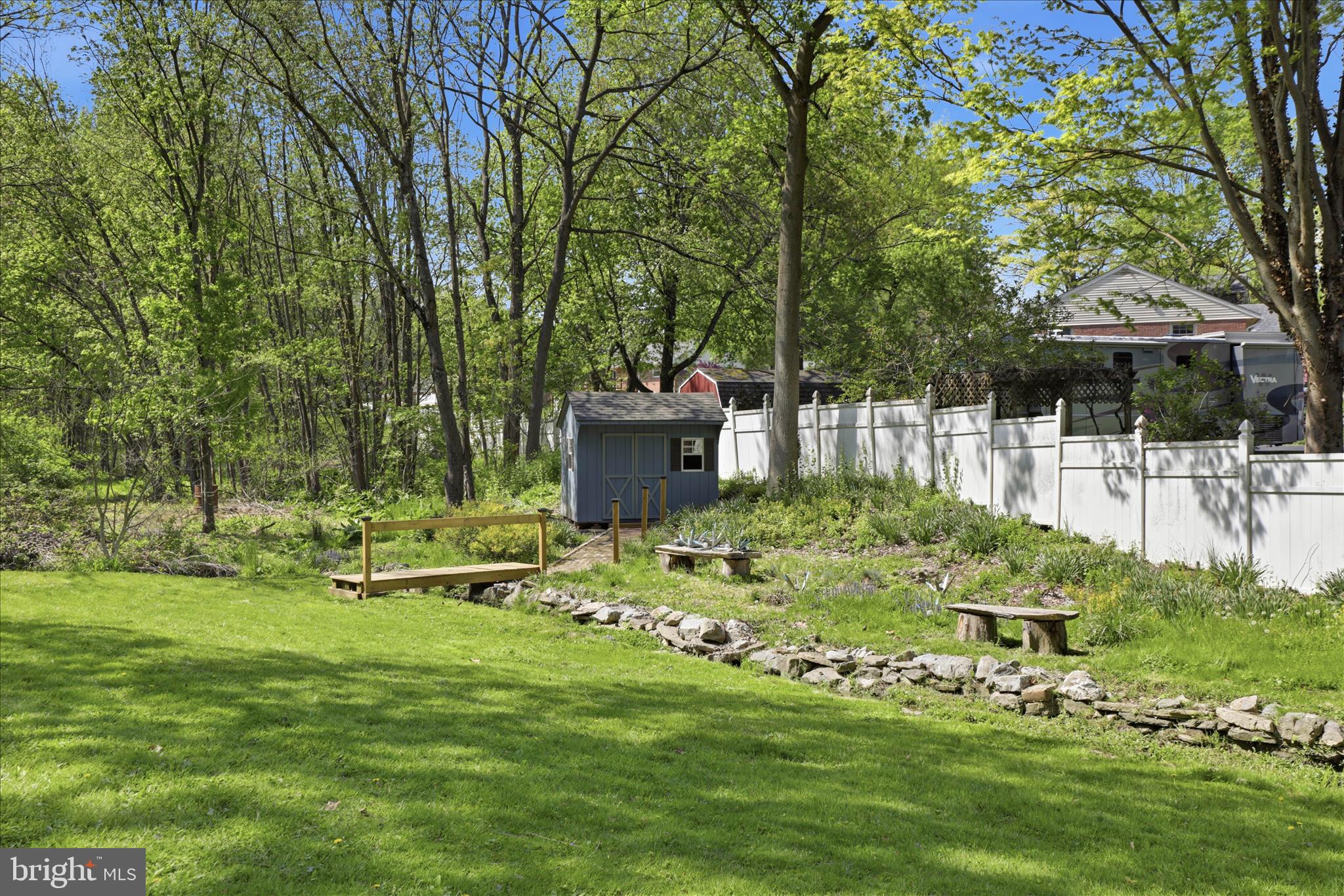 137 East Woods Drive Lititz, PA 17543 - Photo 57 of 64 a garden with trees in front of it
