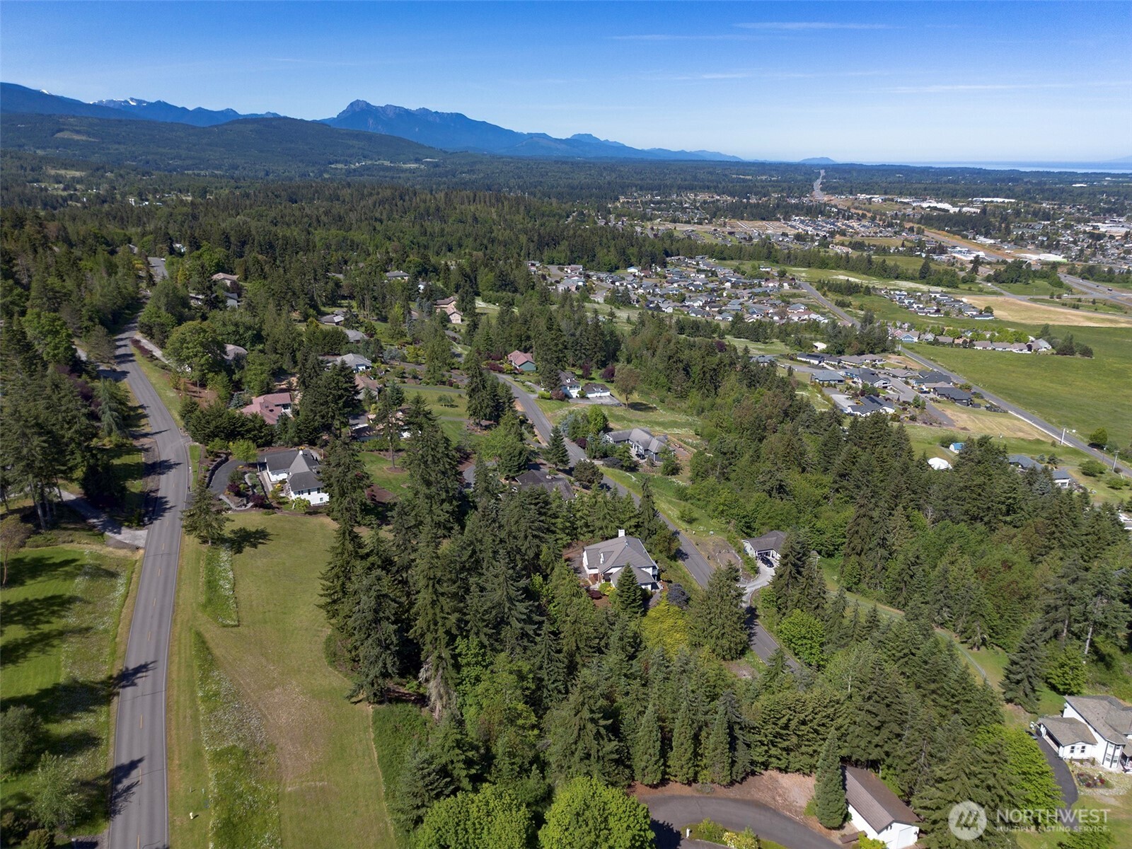 -nka Owls Nest Road Sequim, WA 98382 - Photo 37 of 38 a view of a city with mountains in the background