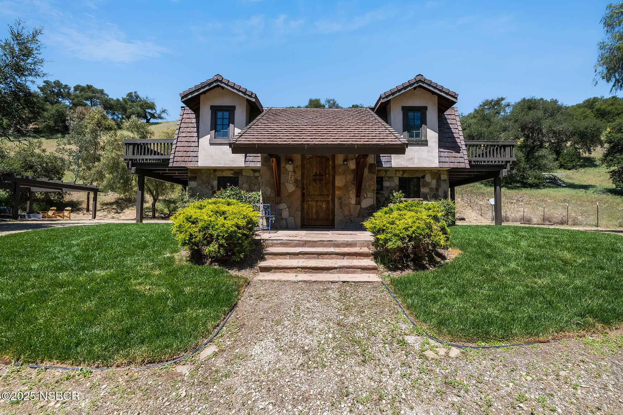 3333-3349 Long Valley Road Santa Ynez, CA 93460 - Photo 25 of 97 a front view of a house with a yard