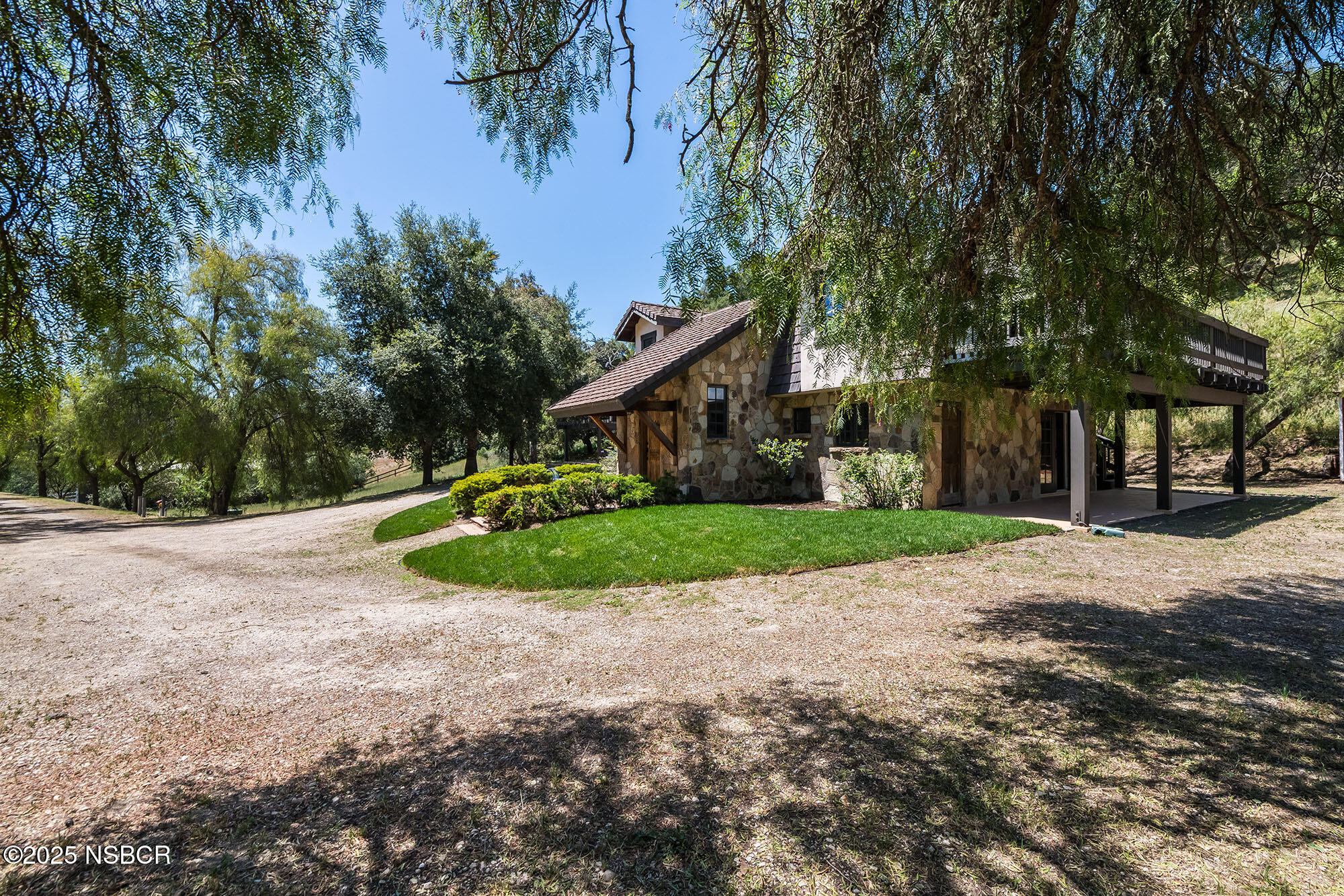 3333-3349 Long Valley Road Santa Ynez, CA 93460 - Photo 26 of 97 a view of a house with a big yard and large trees