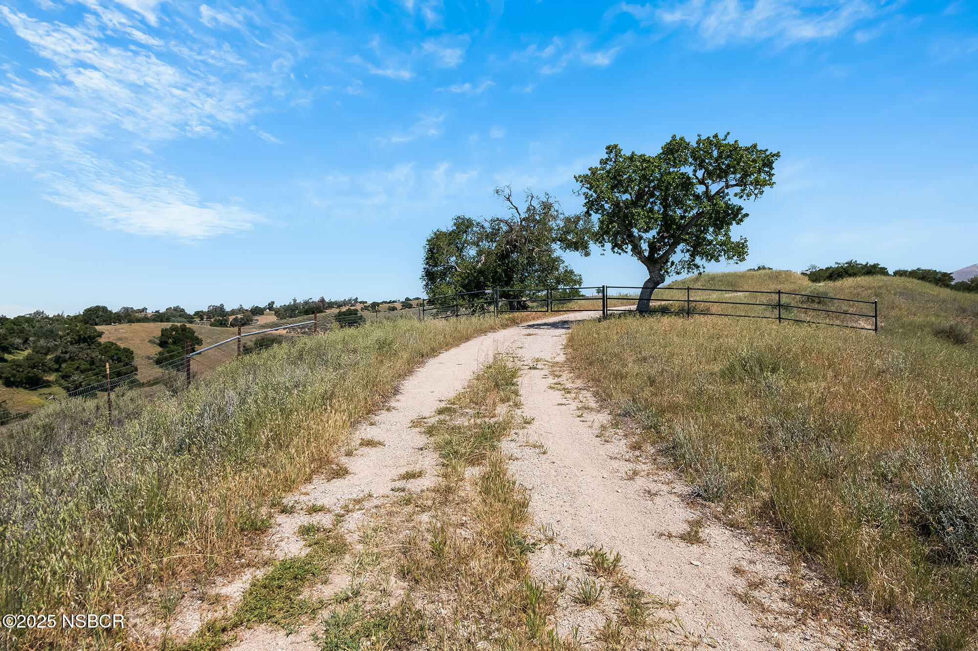 3333-3349 Long Valley Road Santa Ynez, CA 93460 - Photo 31 of 97 a view of a lake with a yard