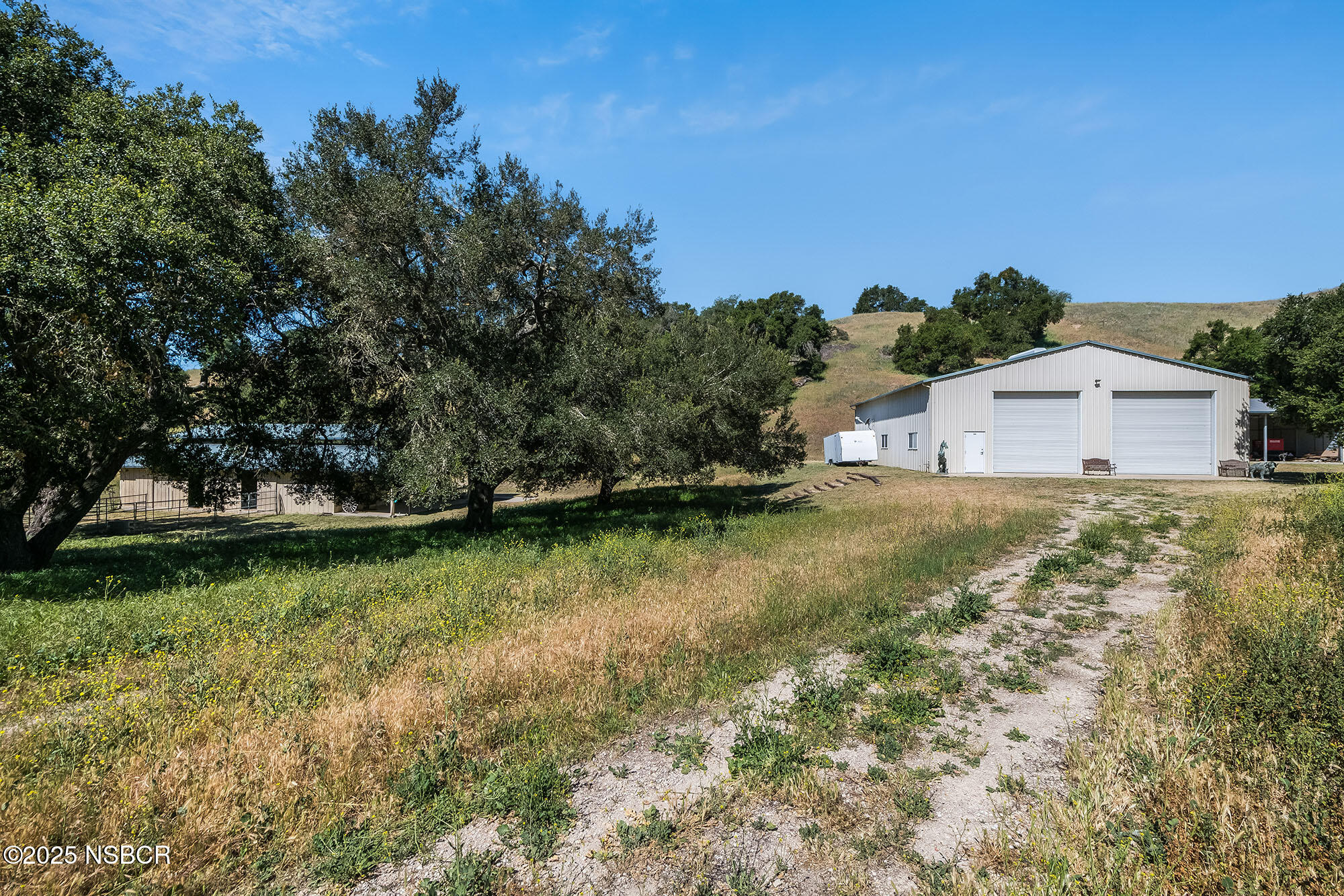 3333-3349 Long Valley Road Santa Ynez, CA 93460 - Photo 32 of 97 a view of a house with a yard