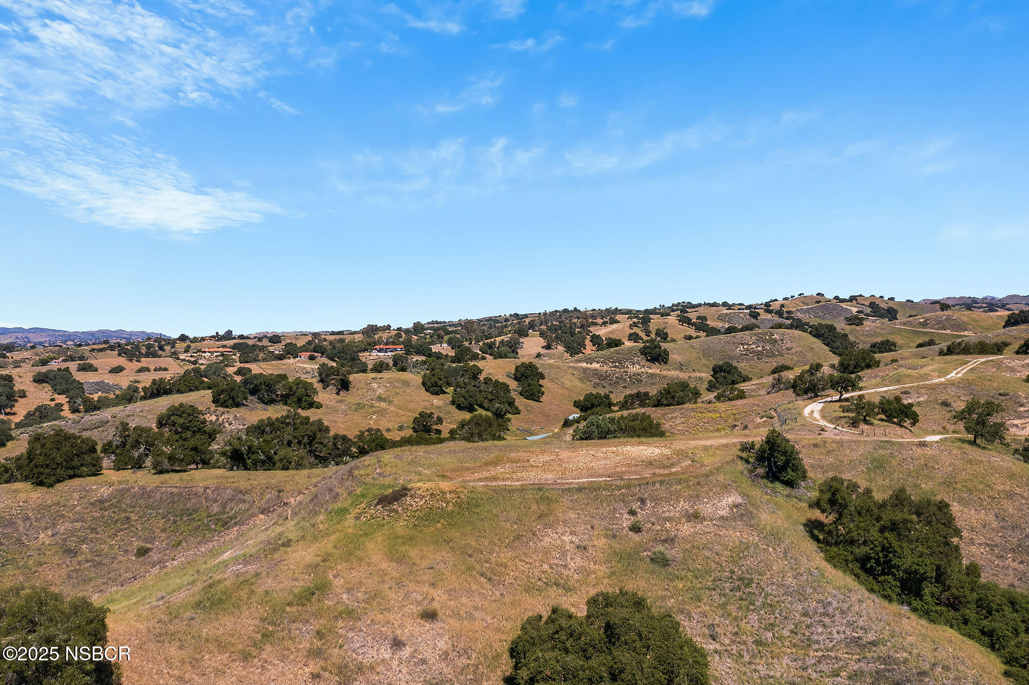 3333-3349 Long Valley Road Santa Ynez, CA 93460 - Photo 43 of 97 a view of a large building with mountains in the background