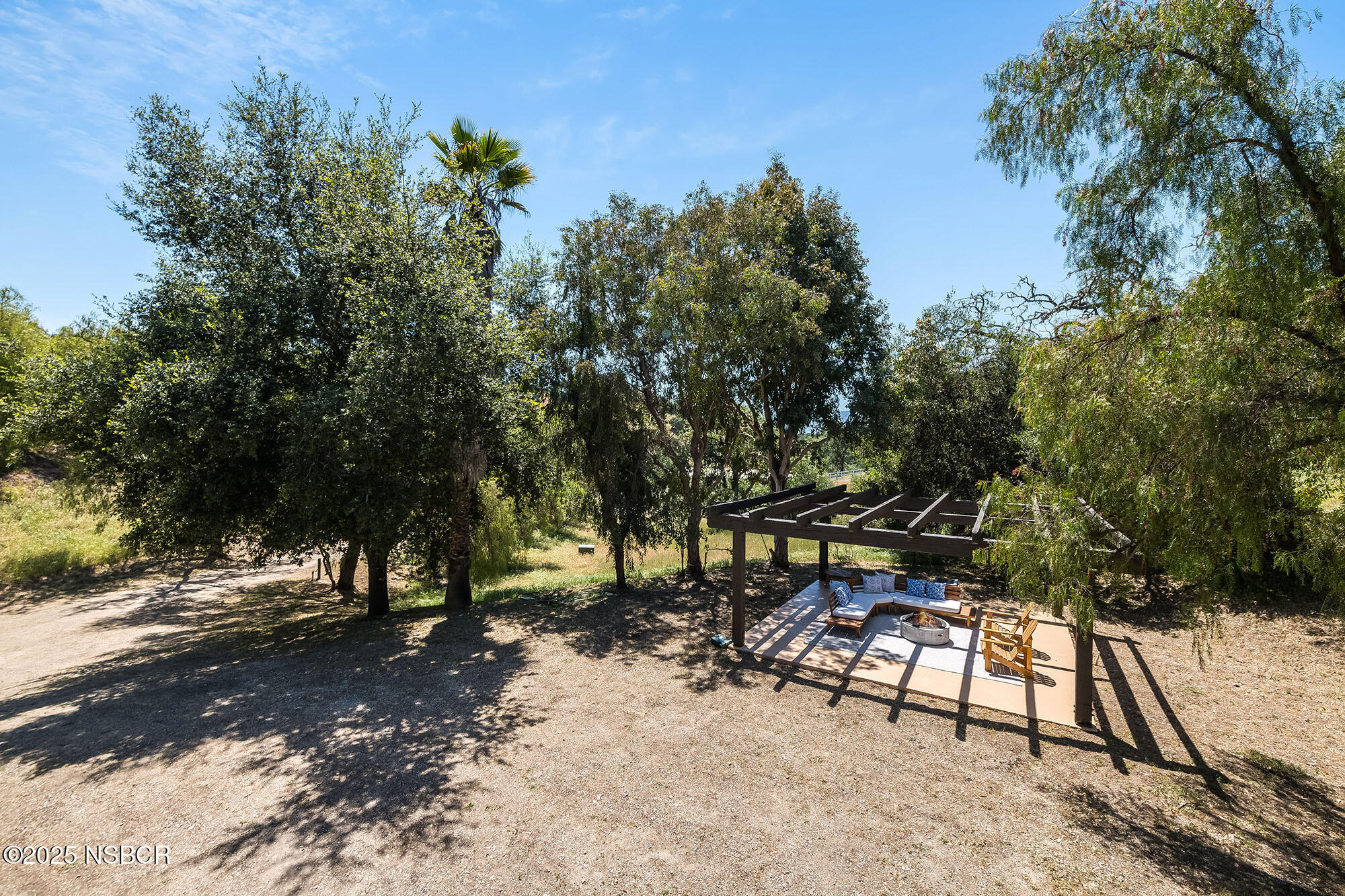 3333-3349 Long Valley Road Santa Ynez, CA 93460 - Photo 48 of 97 a view of a bench in a backyard
