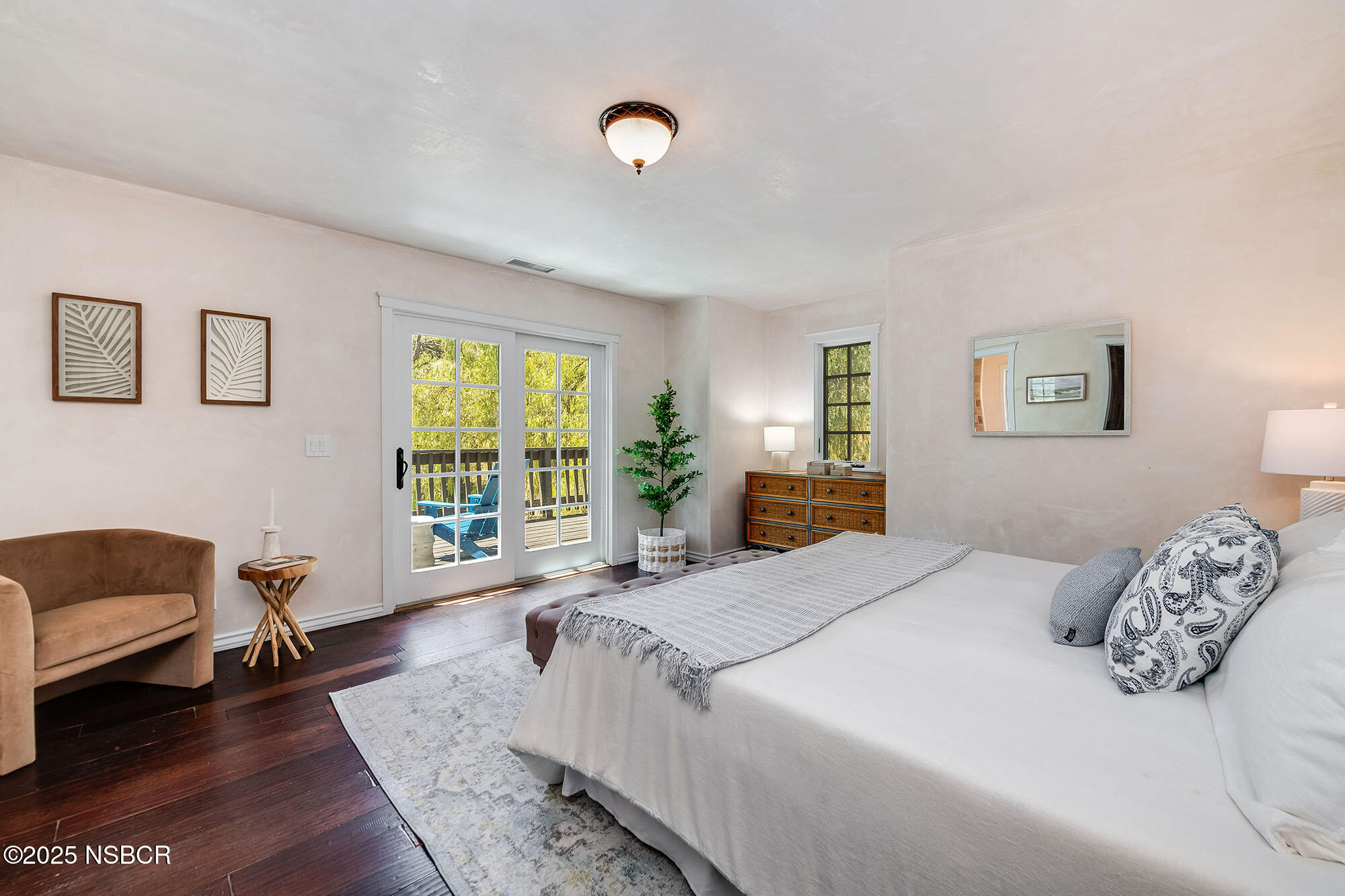 3333-3349 Long Valley Road Santa Ynez, CA 93460 - Photo 56 of 97 a spacious bedroom with a bed a couch and a window