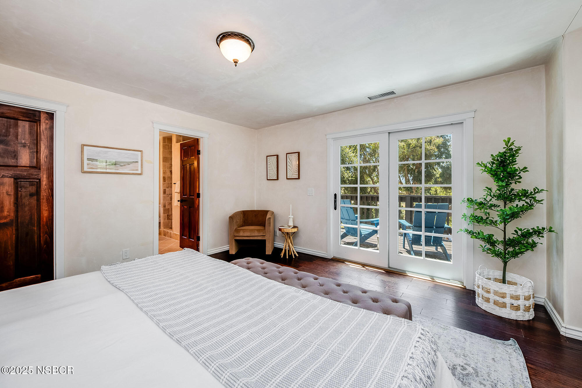 3333-3349 Long Valley Road Santa Ynez, CA 93460 - Photo 57 of 97 a bedroom with a bed and wooden floor