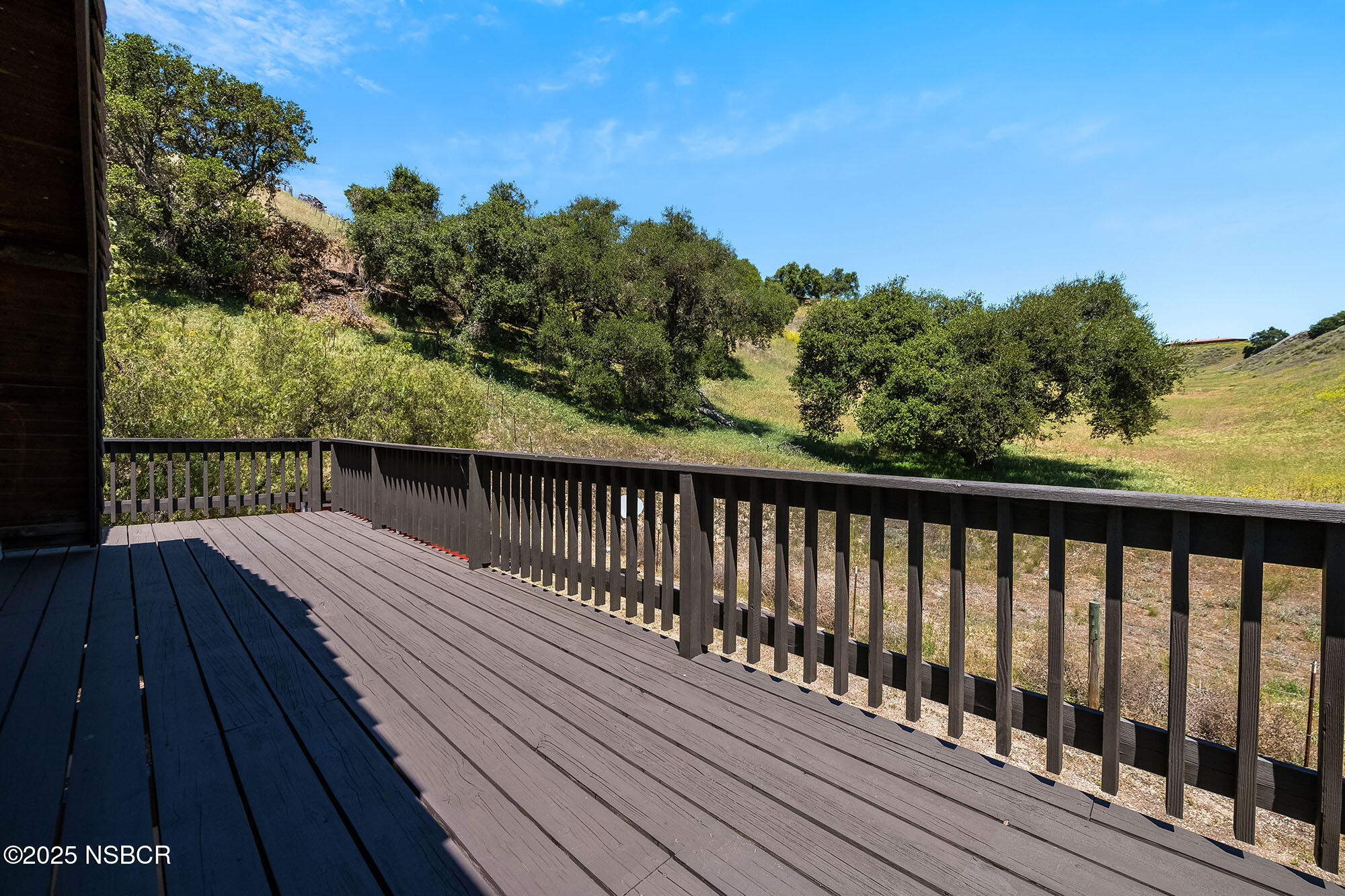 3333-3349 Long Valley Road Santa Ynez, CA 93460 - Photo 69 of 97 a balcony with wooden floor and fence