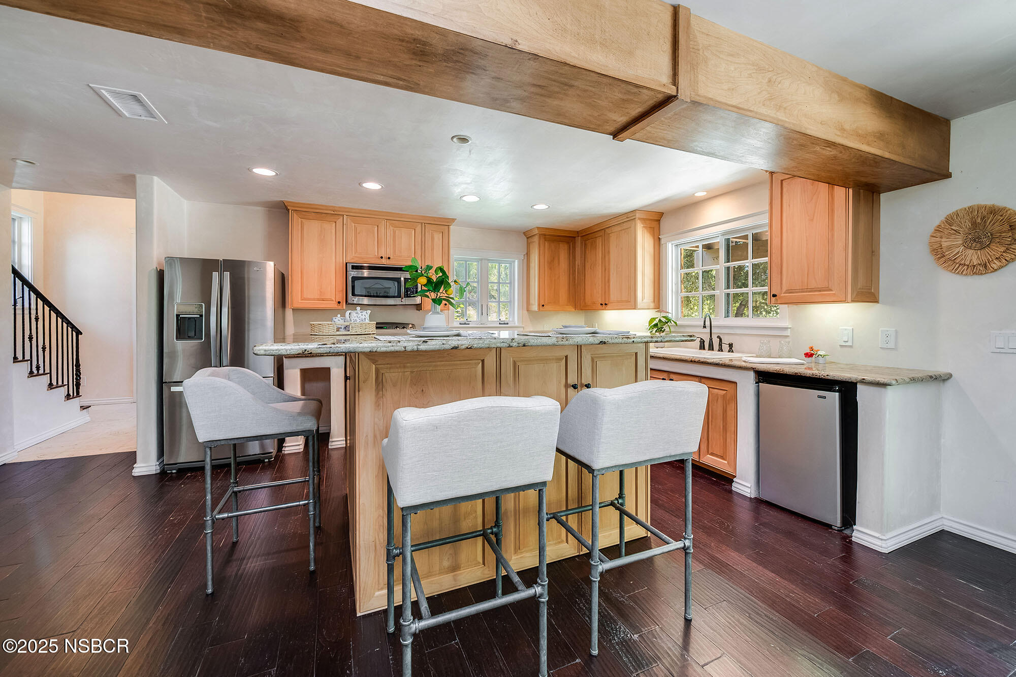 3333-3349 Long Valley Road Santa Ynez, CA 93460 - Photo 80 of 97 a kitchen with stainless steel appliances granite countertop a stove a refrigerator a kitchen island with a dining table and chairs