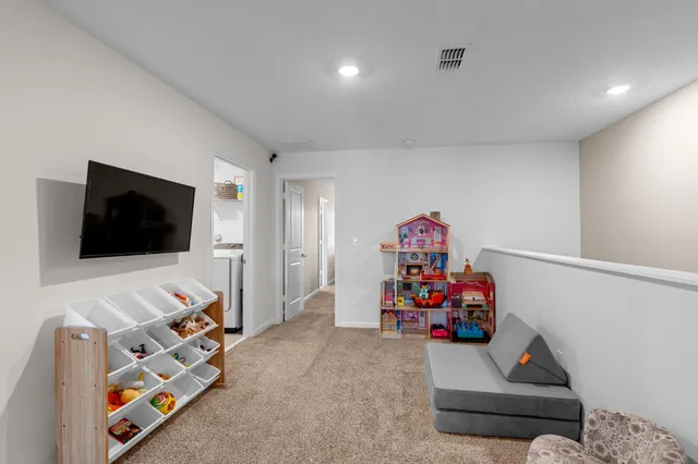 a bedroom with bed and a window