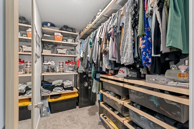 a bathroom with a granite countertop sink mirror and shower