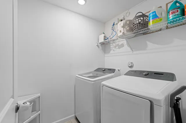 a view of a chair and tables in the patio