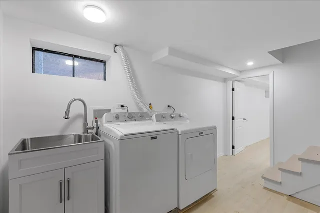 a view of storage and utility room with a sink