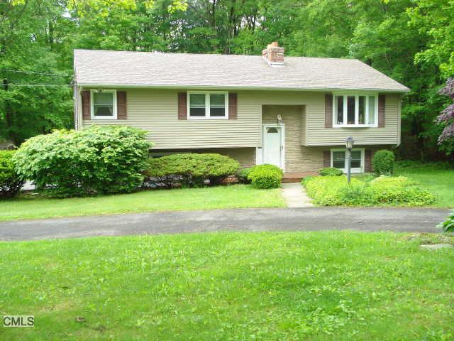 129 Taylor Road New Milford, CT 06776 - Photo 1 of 1 a front view of a house with a yard