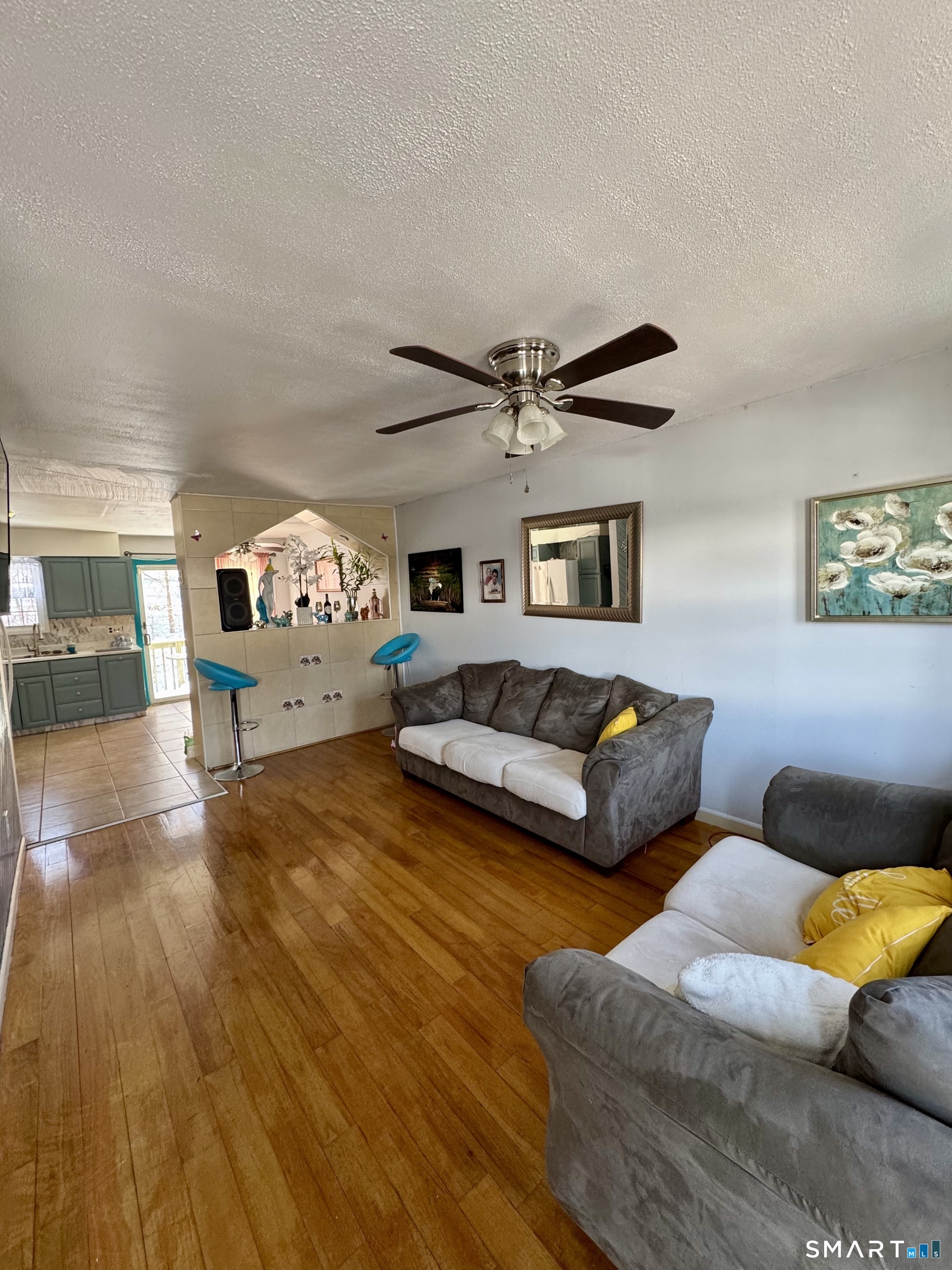 12 Scuppo Road, Unit D4 Danbury, CT 06811 - Photo 3 of 8 a bedroom with furniture and a wooden floor