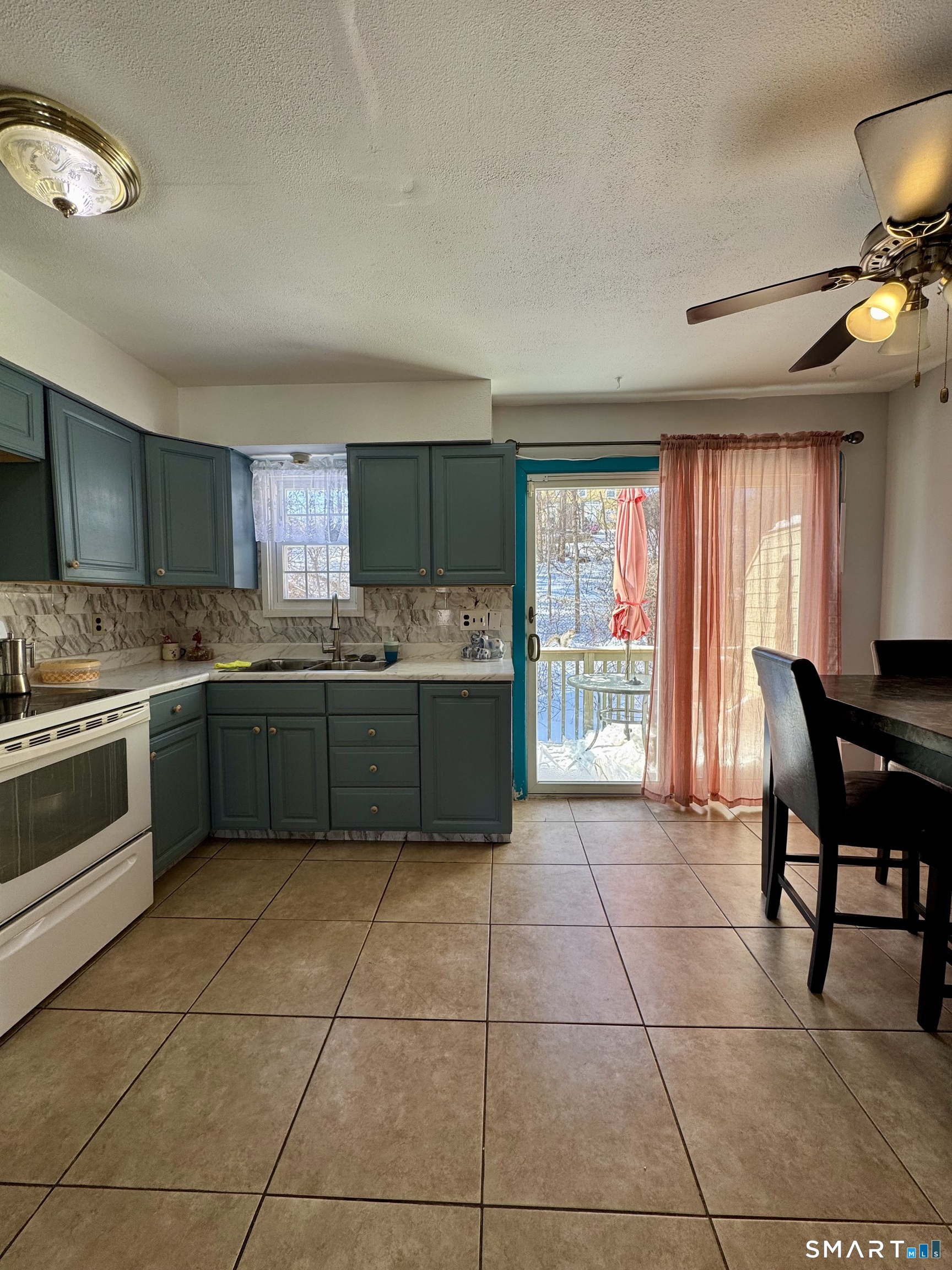 12 Scuppo Road, Unit D4 Danbury, CT 06811 - Photo 6 of 8 a kitchen with a cabinets a sink and a stove