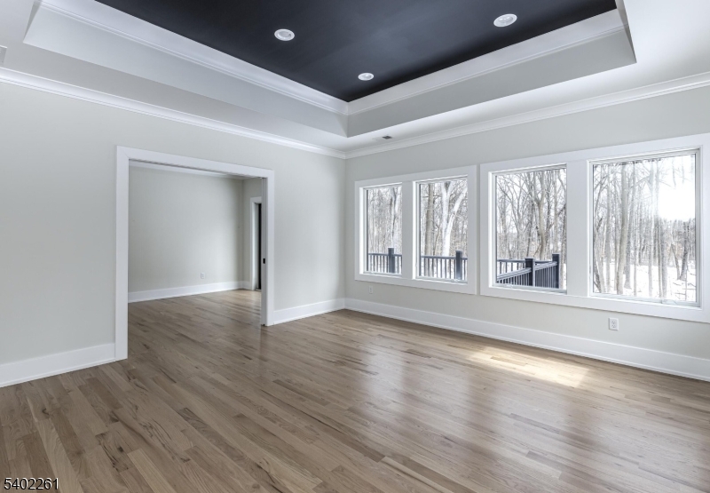 8 Juniper Pointe Trail Dunellen, NJ 08812 - Photo 11 of 37 a view of an empty room with wooden floor and a window