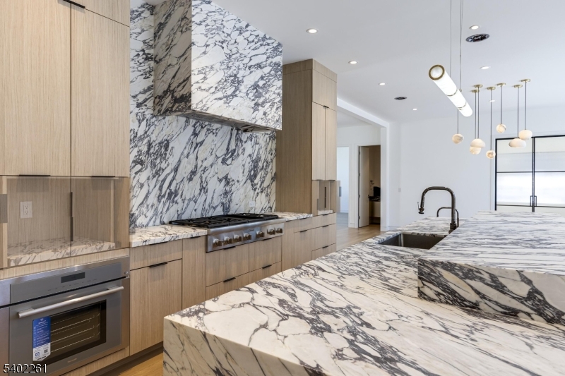8 Juniper Pointe Trail Dunellen, NJ 08812 - Photo 21 of 37 a kitchen with stainless steel appliances granite countertop a stove a sink and a refrigerator