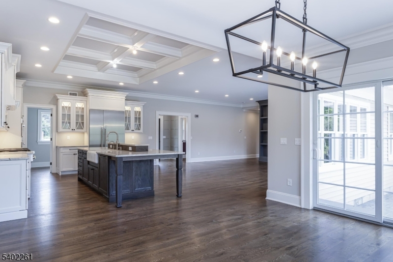 8 Juniper Pointe Trail Dunellen, NJ 08812 - Photo 25 of 37 a view of a kitchen and dining room with wooden floor