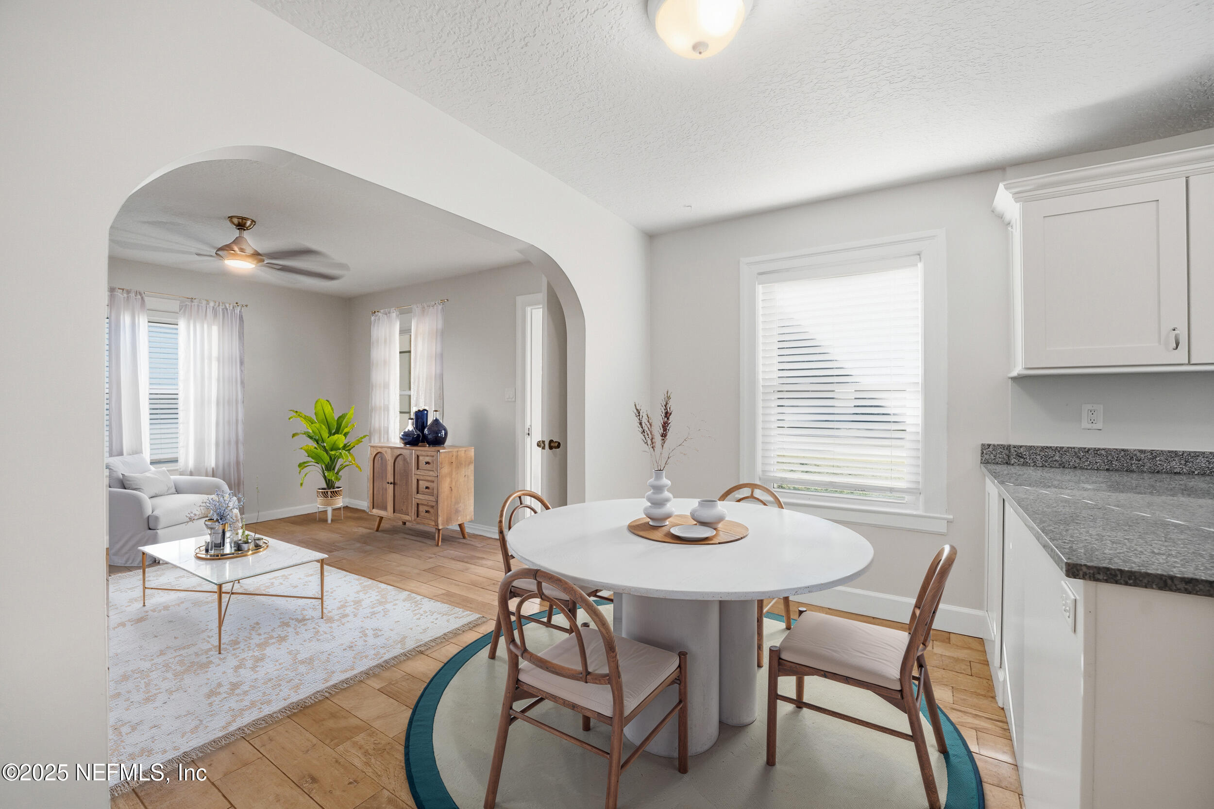 1211 Penman Road Jacksonville Beach, FL 32250 - Photo 13 of 44 a dining room with furniture and wooden floor