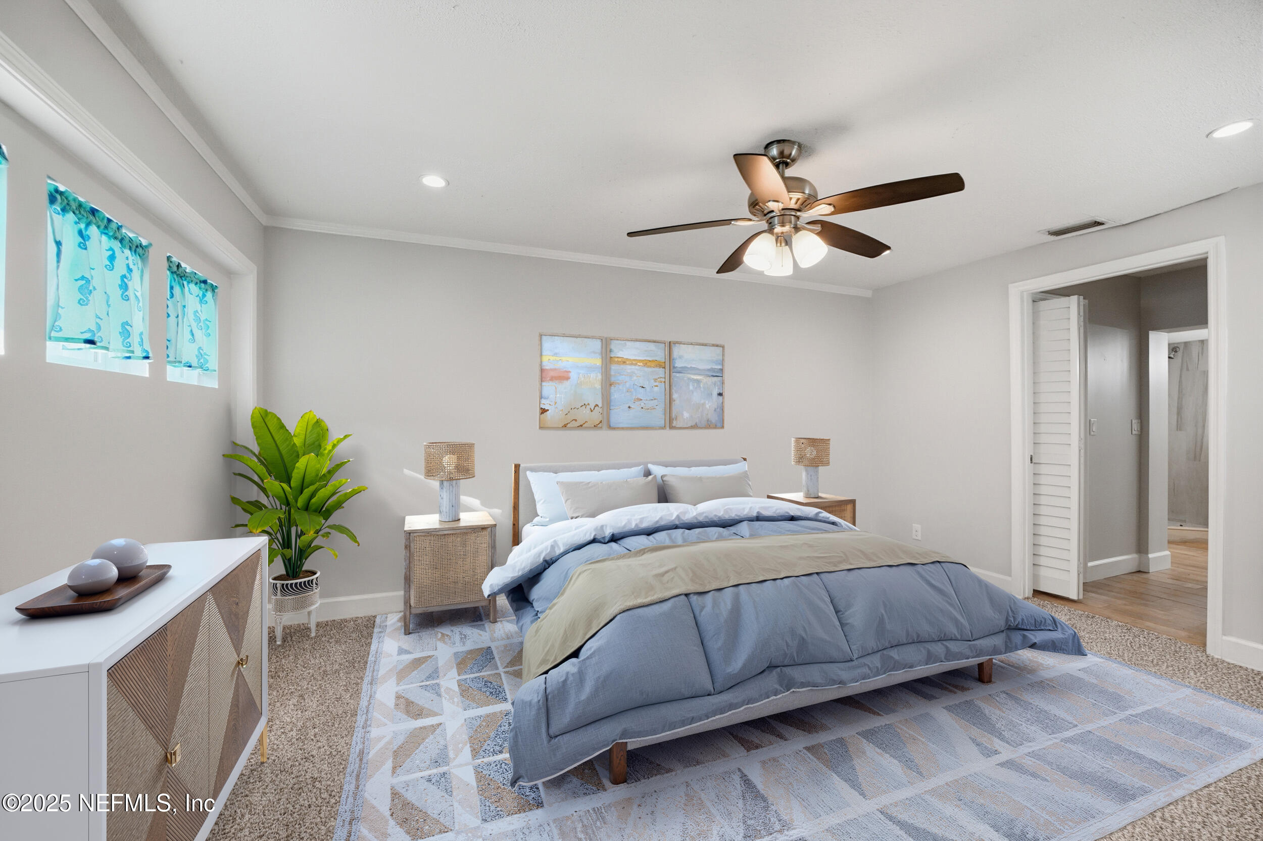 1211 Penman Road Jacksonville Beach, FL 32250 - Photo 17 of 44 a bedroom with a bed and a chandelier