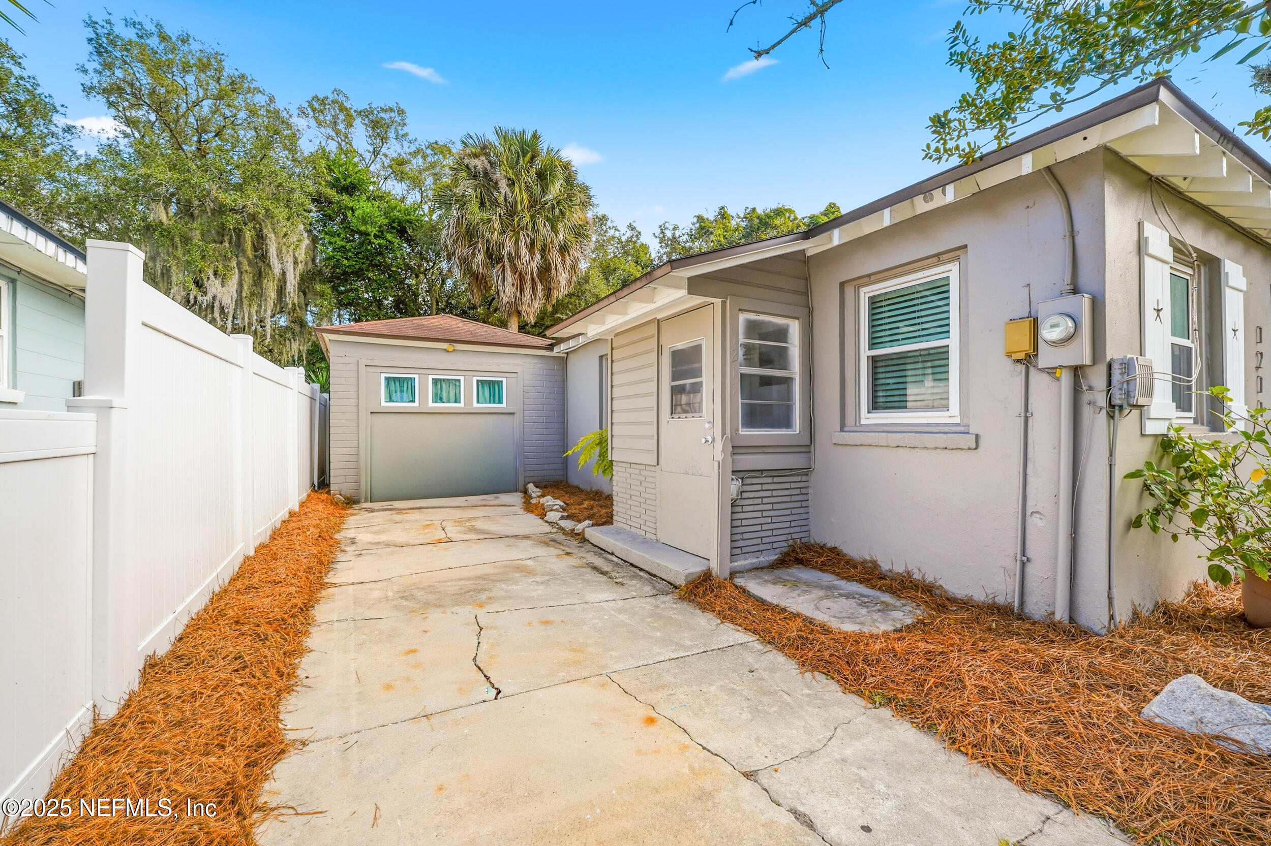 1211 Penman Road Jacksonville Beach, FL 32250 - Photo 2 of 44 a front view of a house with a yard