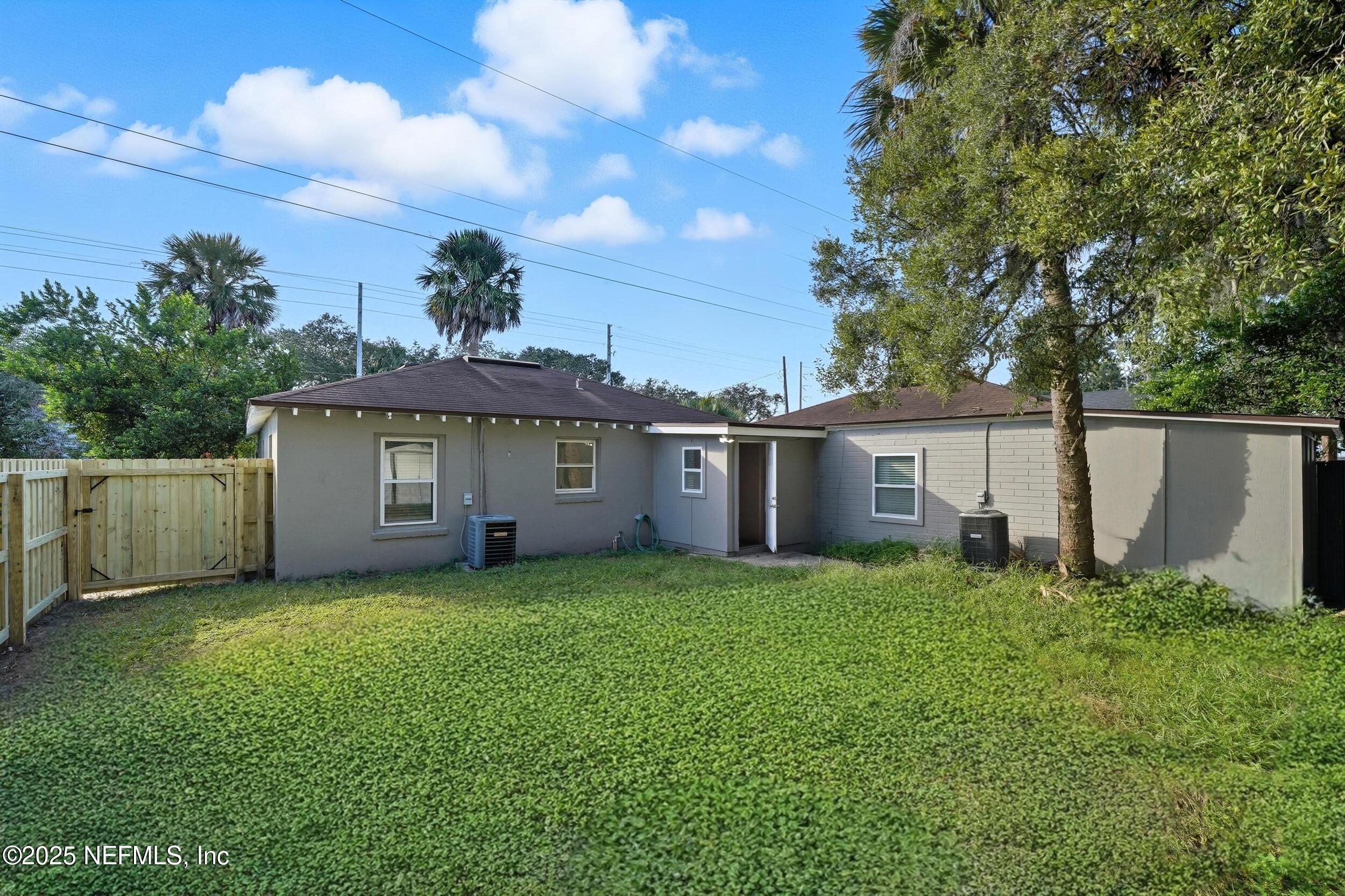 1211 Penman Road Jacksonville Beach, FL 32250 - Photo 27 of 44 a view of a house with a yard