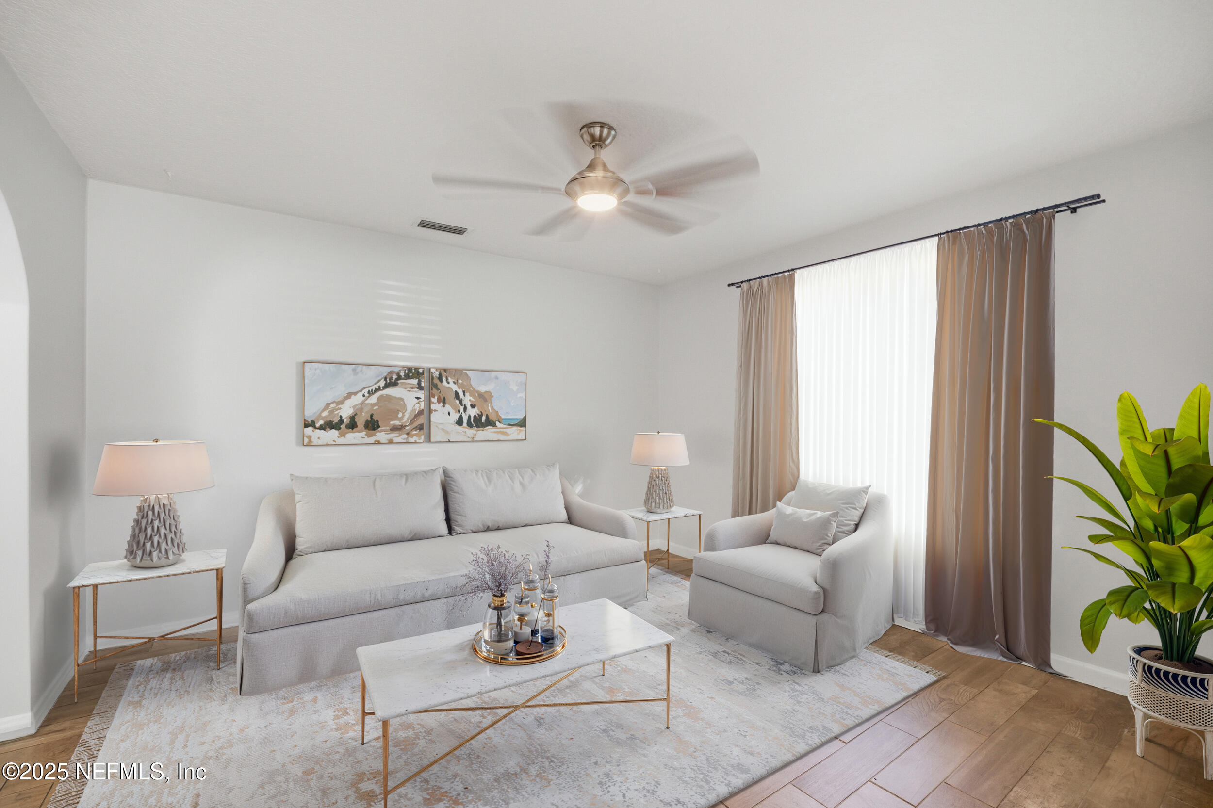 1211 Penman Road Jacksonville Beach, FL 32250 - Photo 6 of 44 a living room with furniture and a potted plant