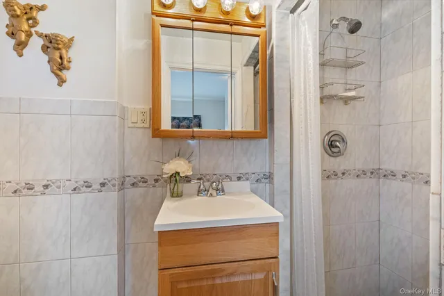 a bathroom with a sink and mirror
