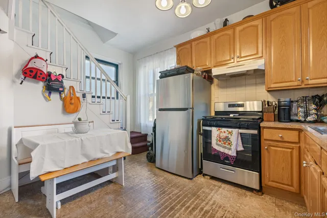 a bedroom with a bed and large windows