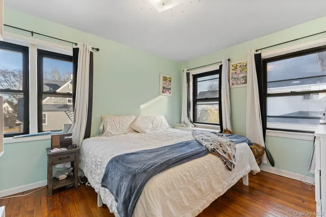 a bedroom with a bed furniture and a window