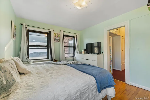 a bed room with a bed and a baby crib