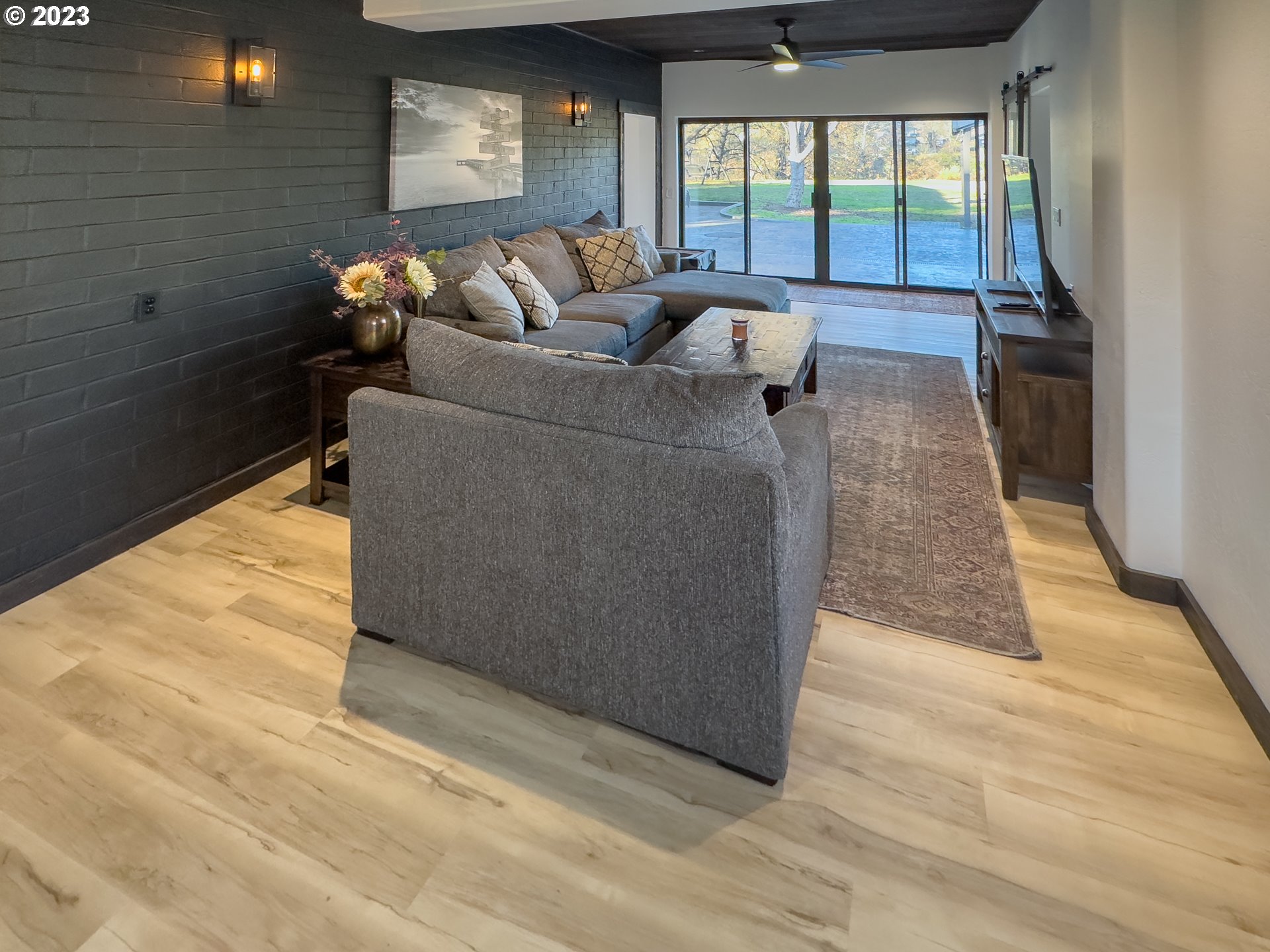 508 Edgewater Drive Grants Pass, OR 97527 - Photo 11 of 48 a living room with furniture and a floor to ceiling window