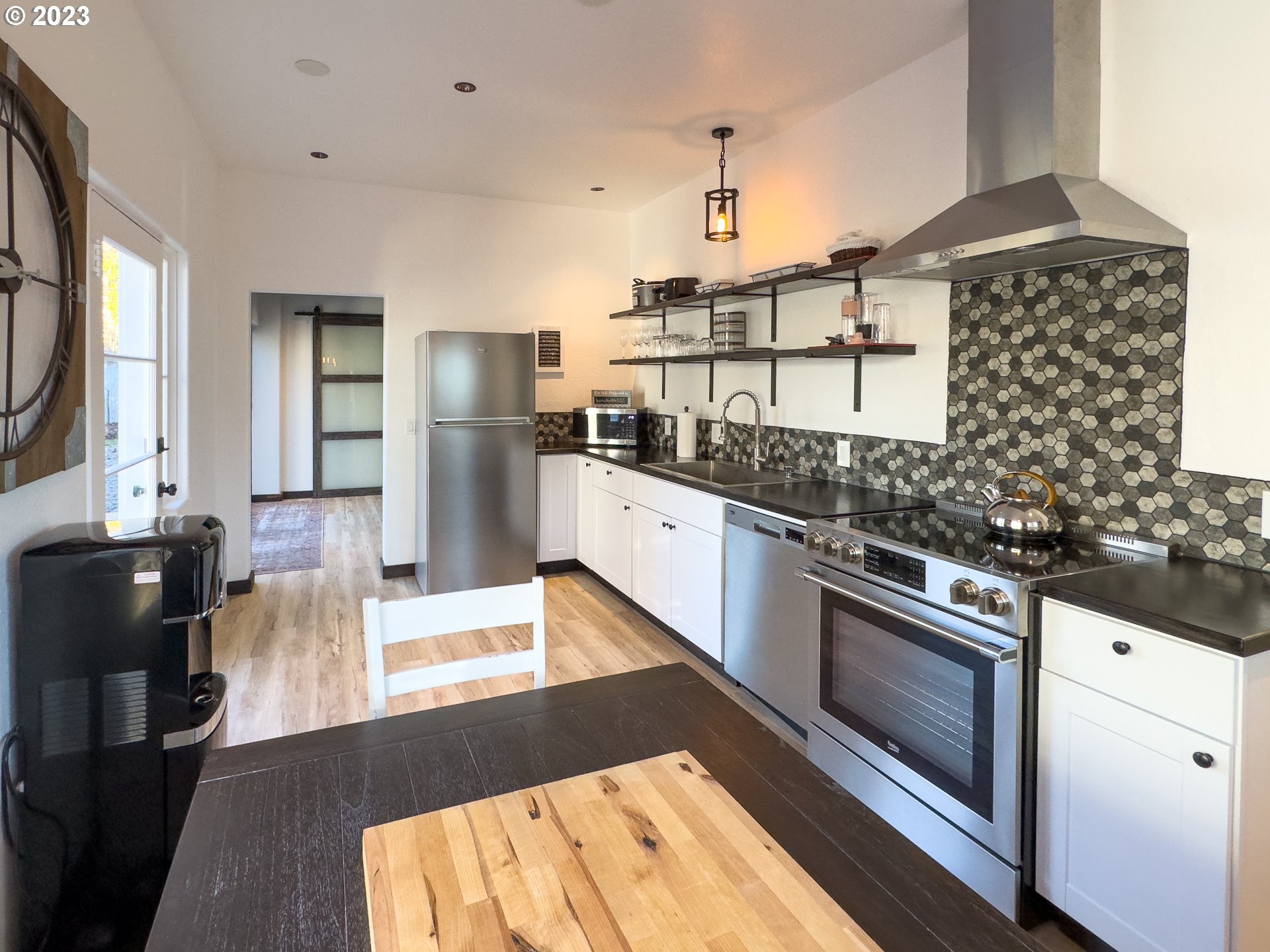 508 Edgewater Drive Grants Pass, OR 97527 - Photo 14 of 48 a kitchen with stainless steel appliances granite countertop a stove a sink and a refrigerator