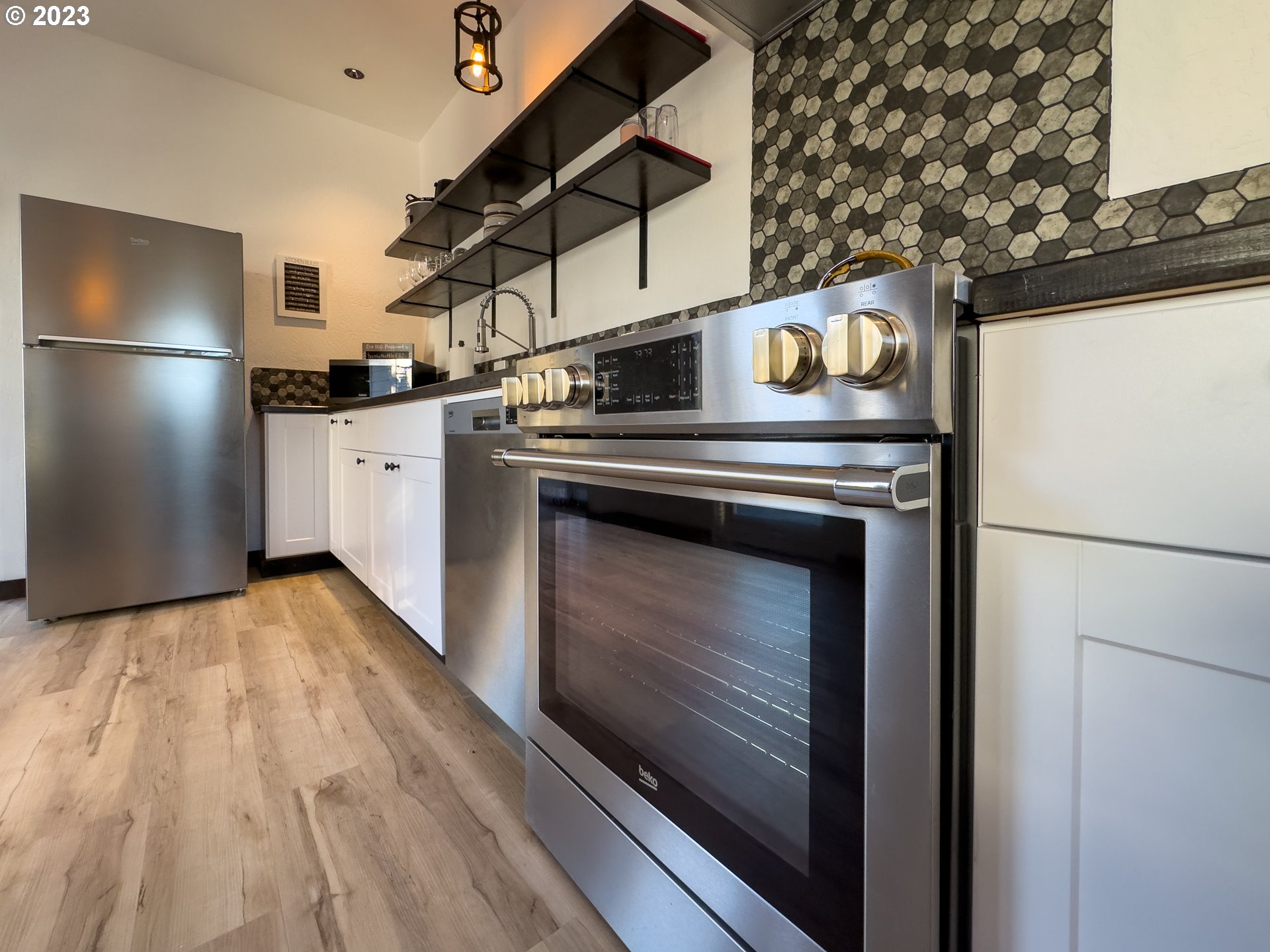 508 Edgewater Drive Grants Pass, OR 97527 - Photo 15 of 48 a kitchen with a stove and a refrigerator