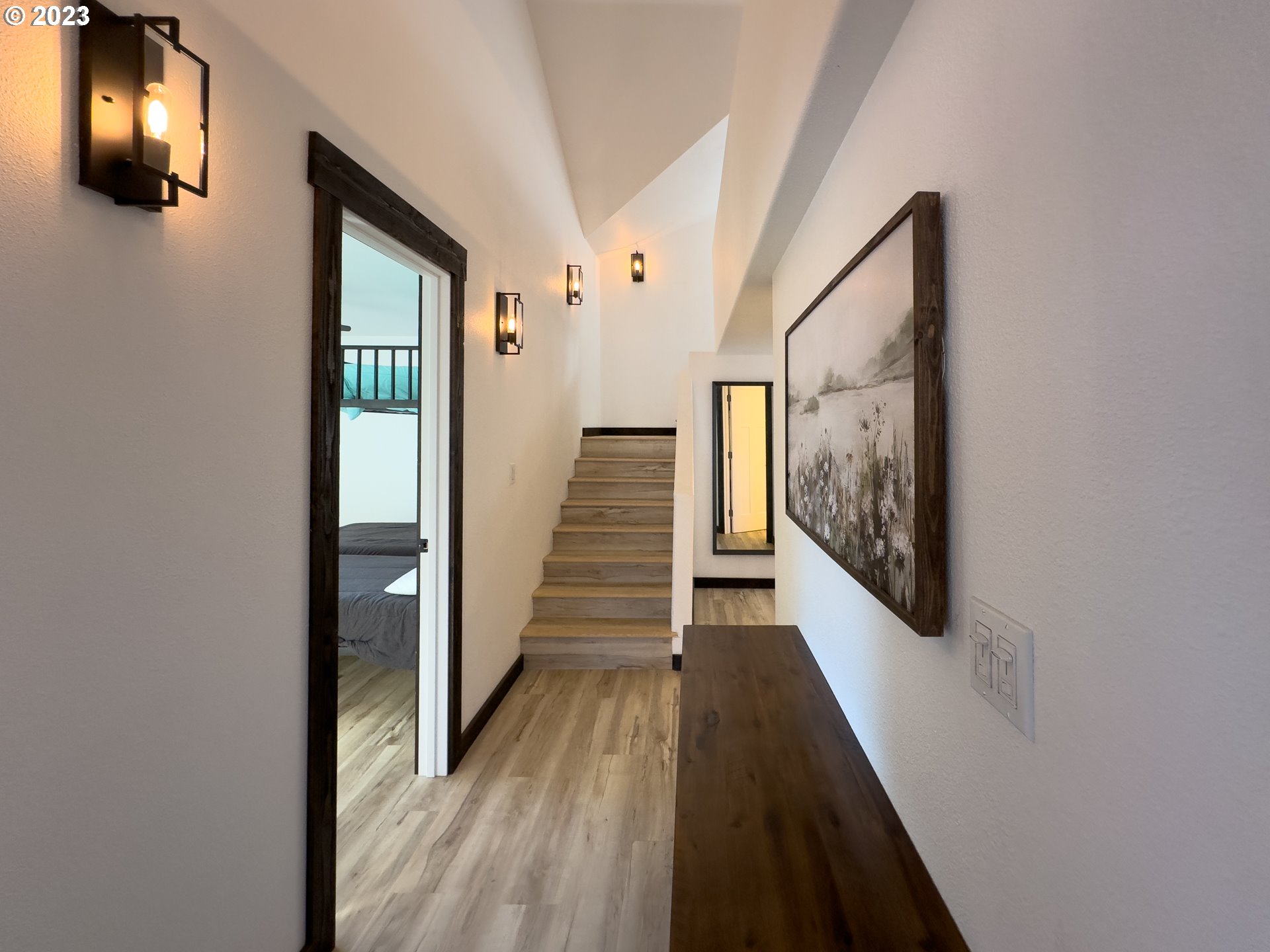 508 Edgewater Drive Grants Pass, OR 97527 - Photo 20 of 48 a view of a hallway with wooden floor and staircase