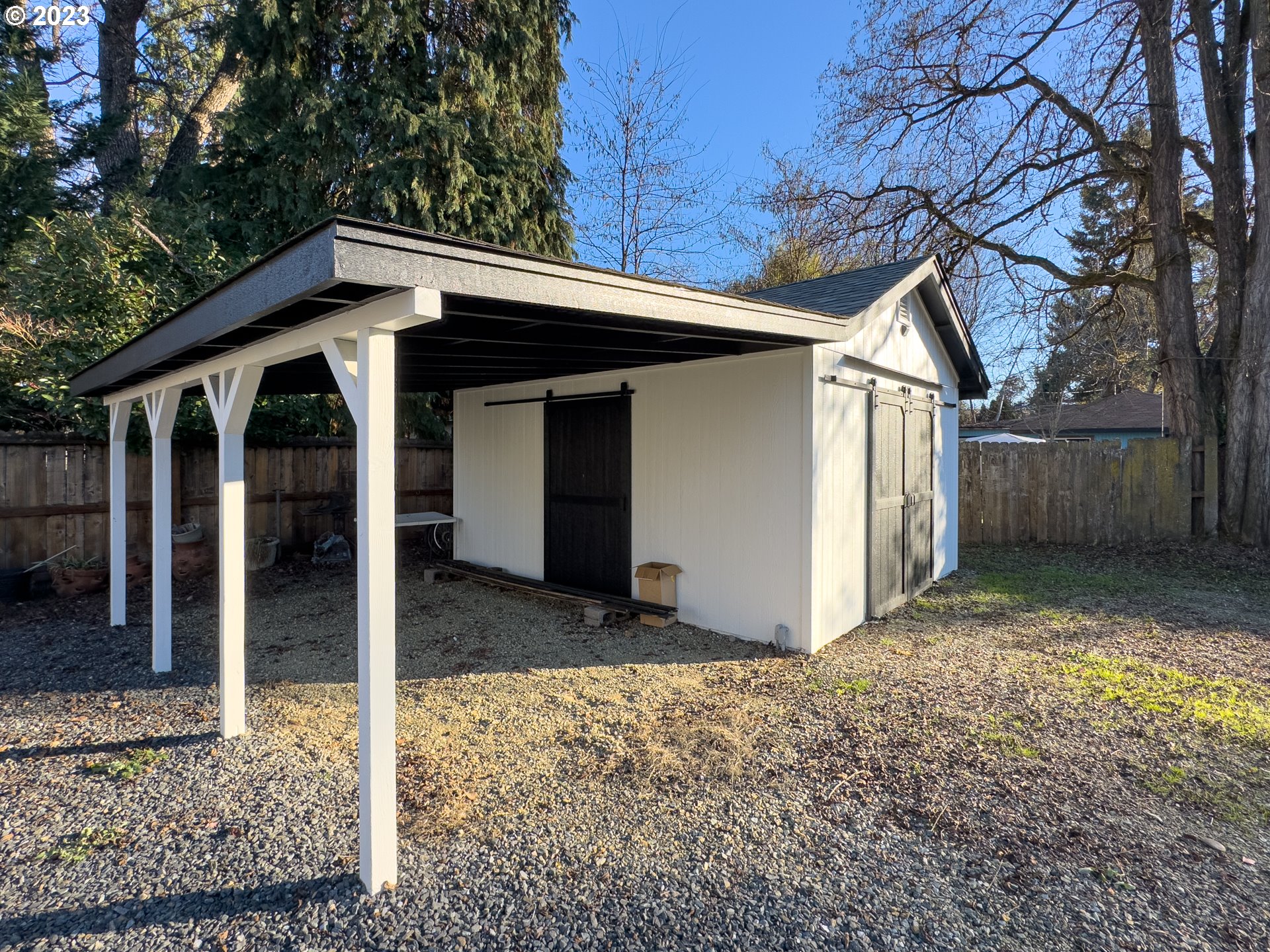 508 Edgewater Drive Grants Pass, OR 97527 - Photo 42 of 48 a view of a house with a large tree and wooden fence