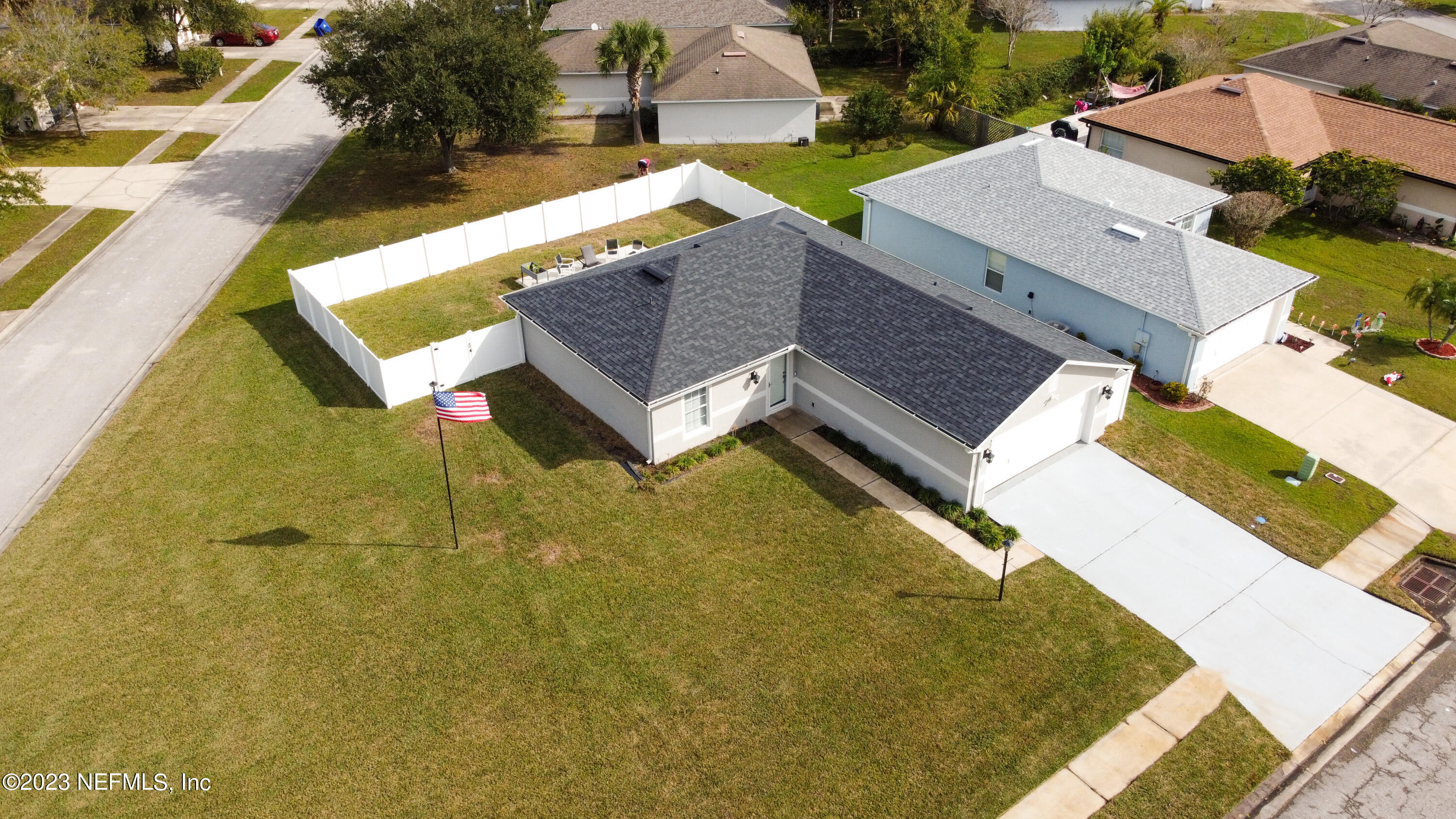an aerial view of residential houses with outdoor space