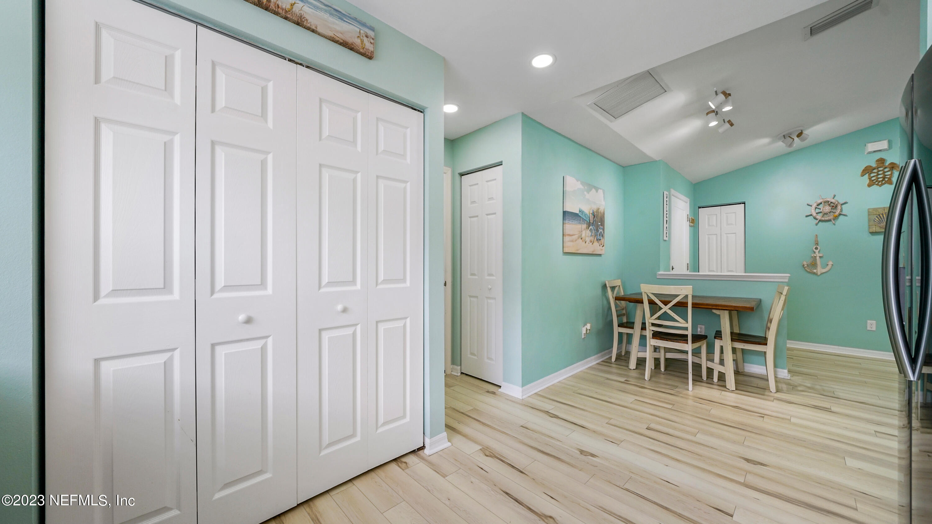 321 West Jayce Way St. Augustine, FL 32084 - Photo 11 of 34 wooden floor and dining room with wooden floor