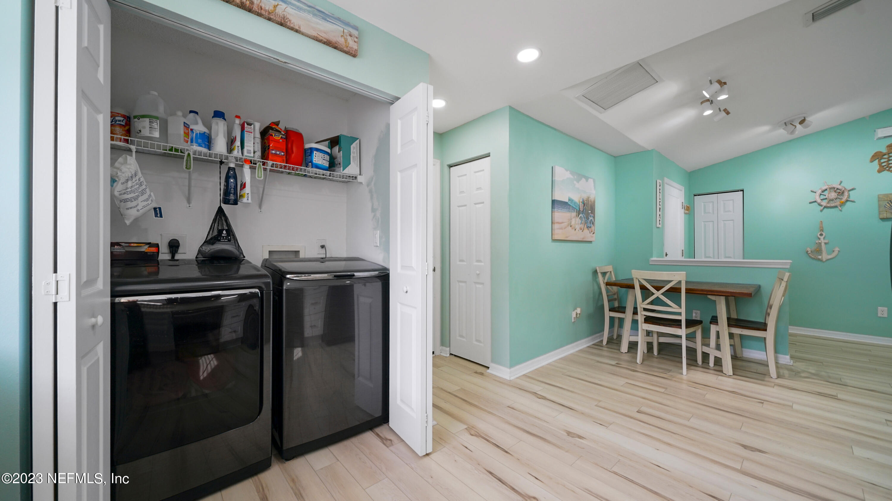 321 West Jayce Way St. Augustine, FL 32084 - Photo 12 of 34 a kitchen with a refrigerator and a dining table