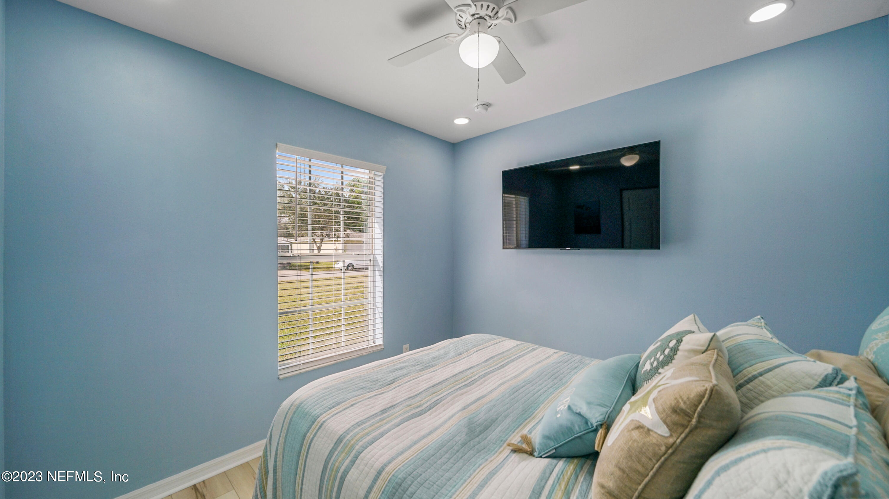 321 West Jayce Way St. Augustine, FL 32084 - Photo 18 of 34 a bedroom with a bed and a flat screen tv